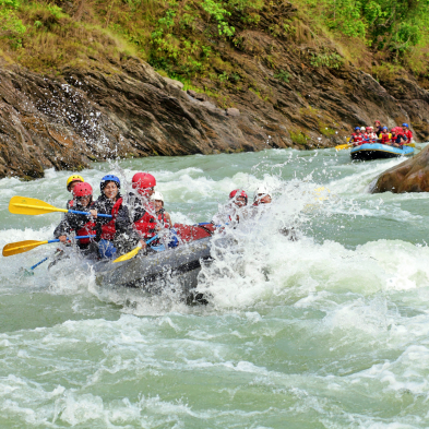 Rafters navigating white-water rapids on the Kelani River at Kitulgala Sri Lanka
