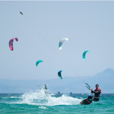 Kitesurfer riding coastal winds and waves at Mũi Né Vietnam