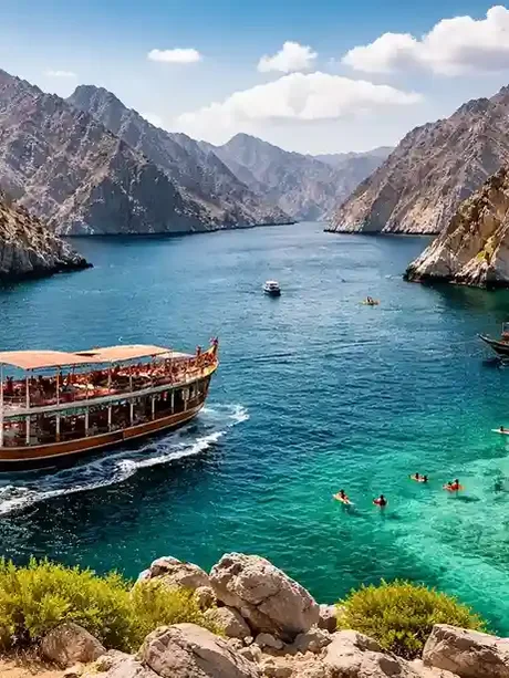 Musandam Dibba coastline with turquoise waters, fjords, and traditional dhow boats