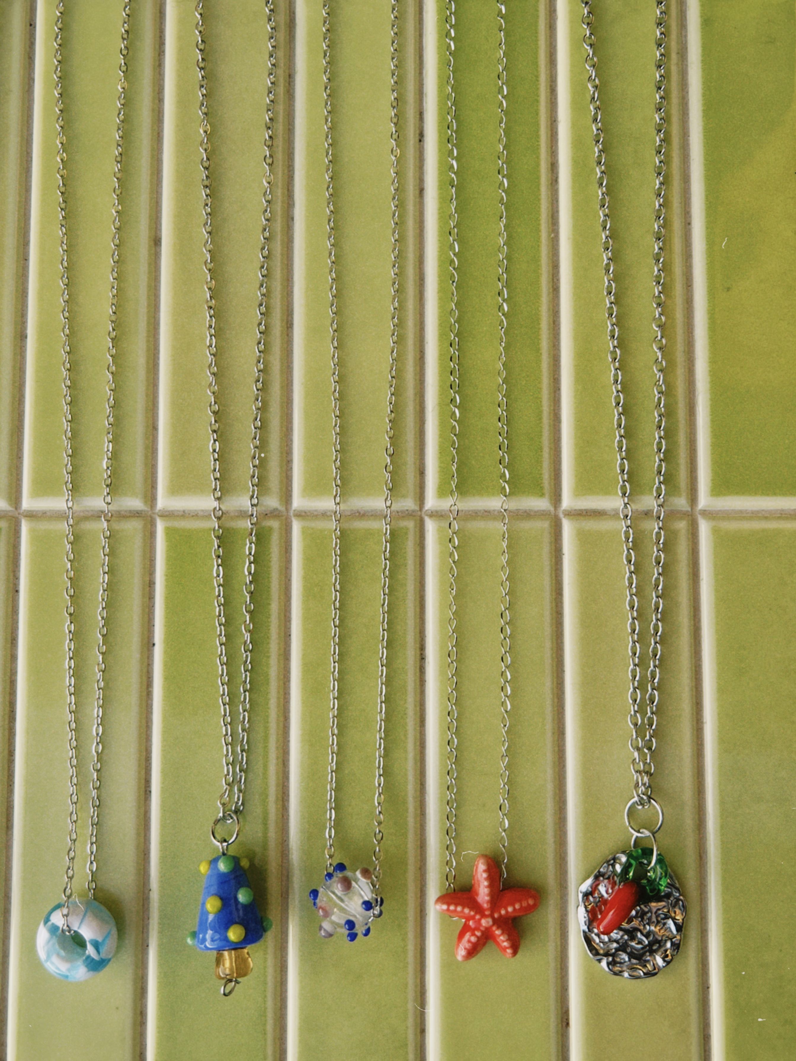 cadena de acero inoxidable y dije