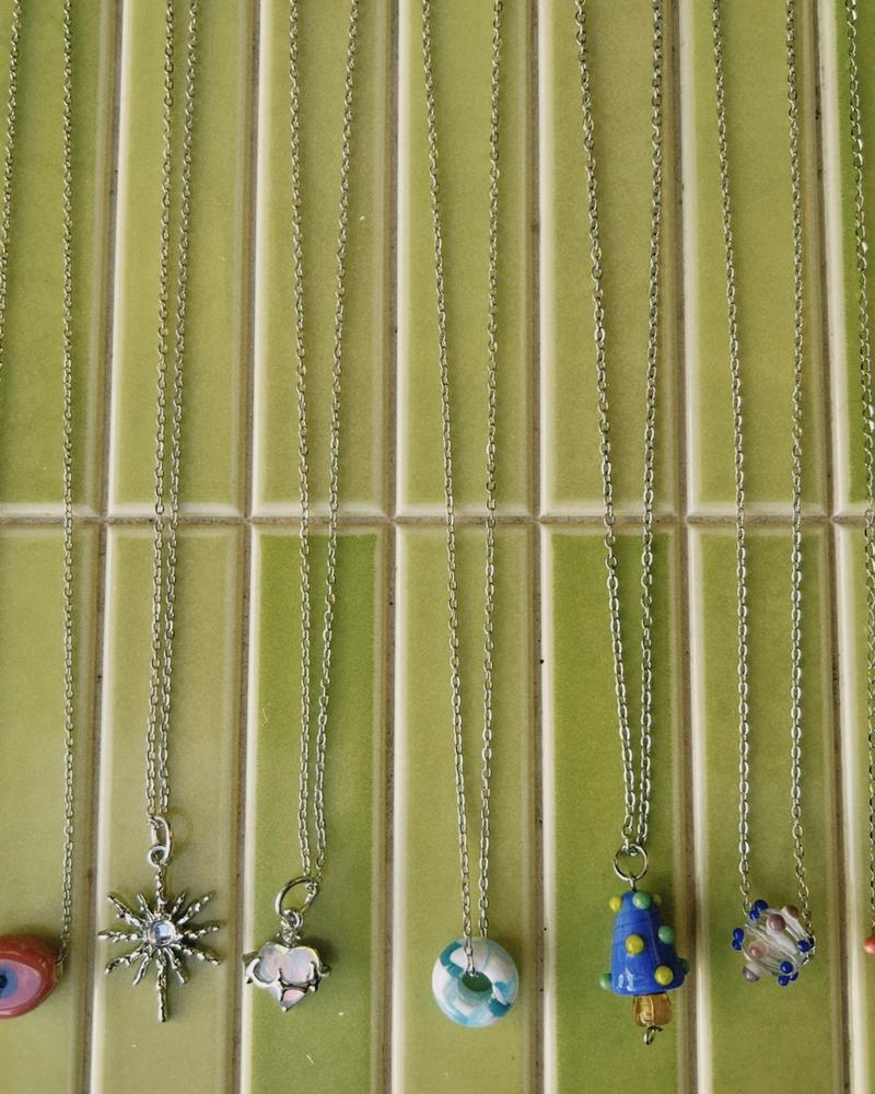 cadena de acero inoxidable y dije