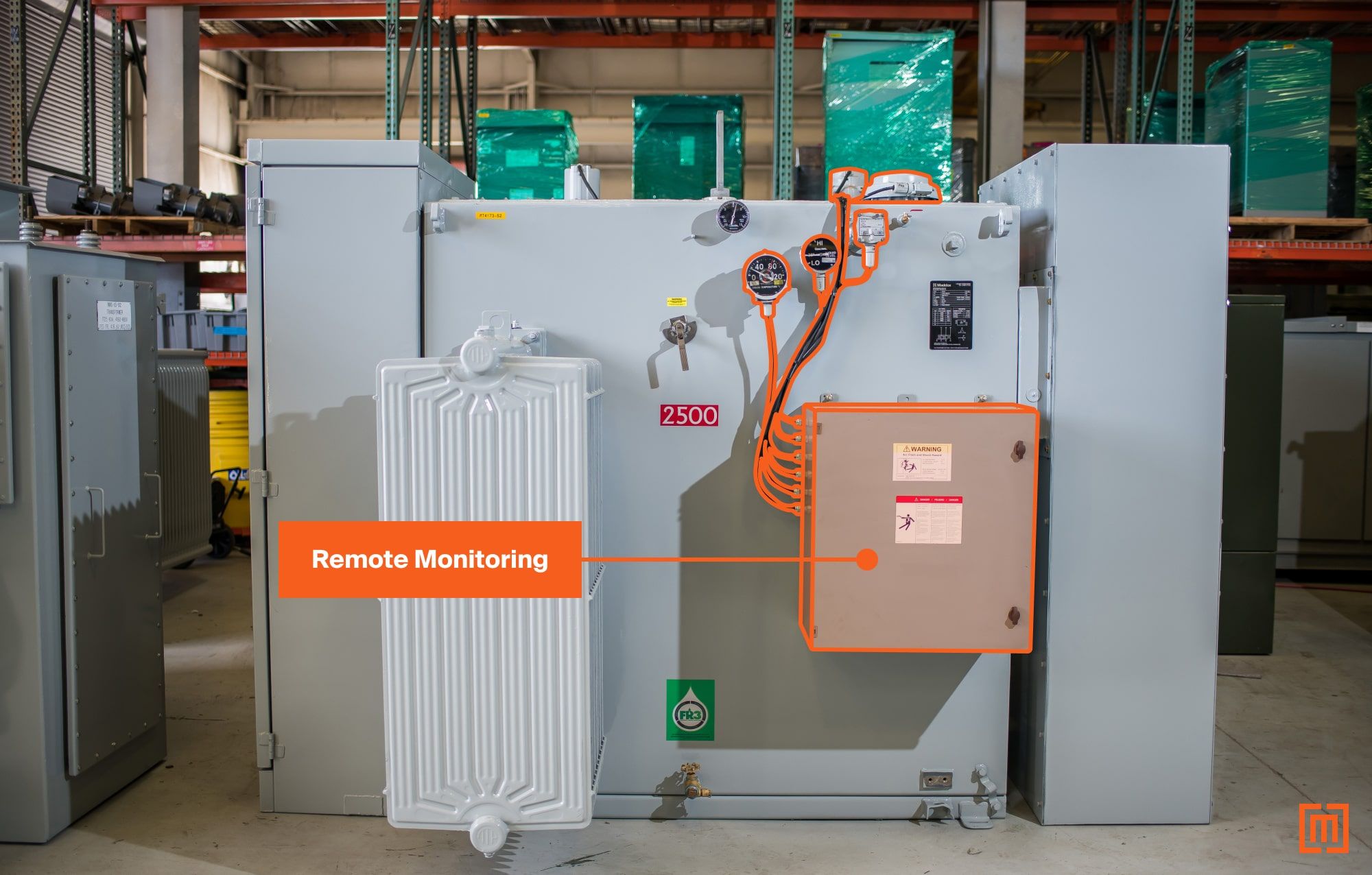A substation transformer with remote monitoring device attached to alarm contacts on transformer gauges