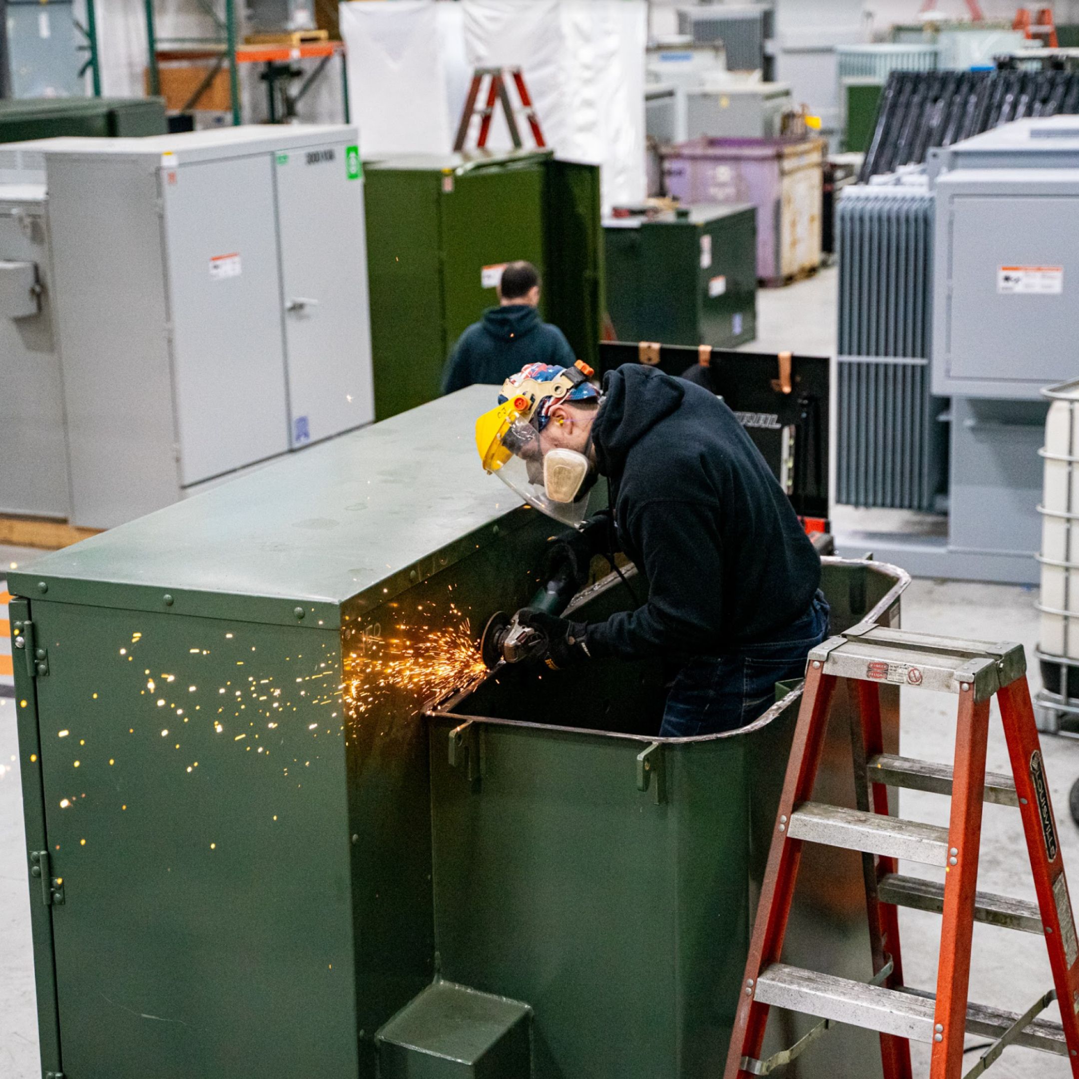 picture of a Maddox technician welding a transformer