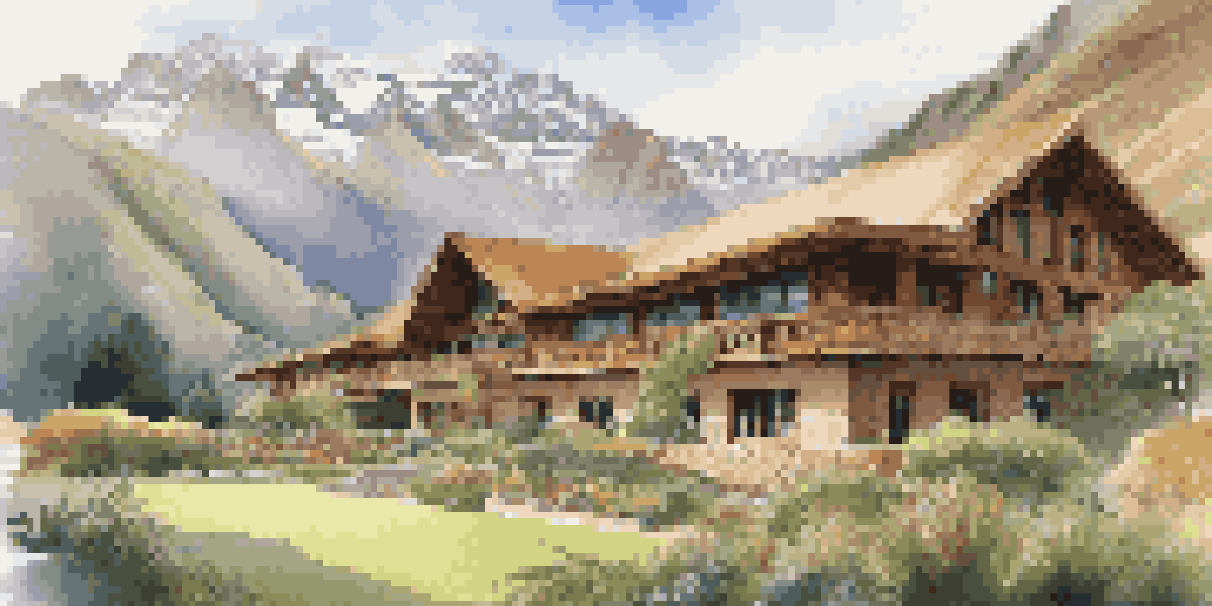 A beautiful lodge nestled in the Sacred Valley with the Andes mountains in the background, surrounded by lush greenery and the Urubamba River.