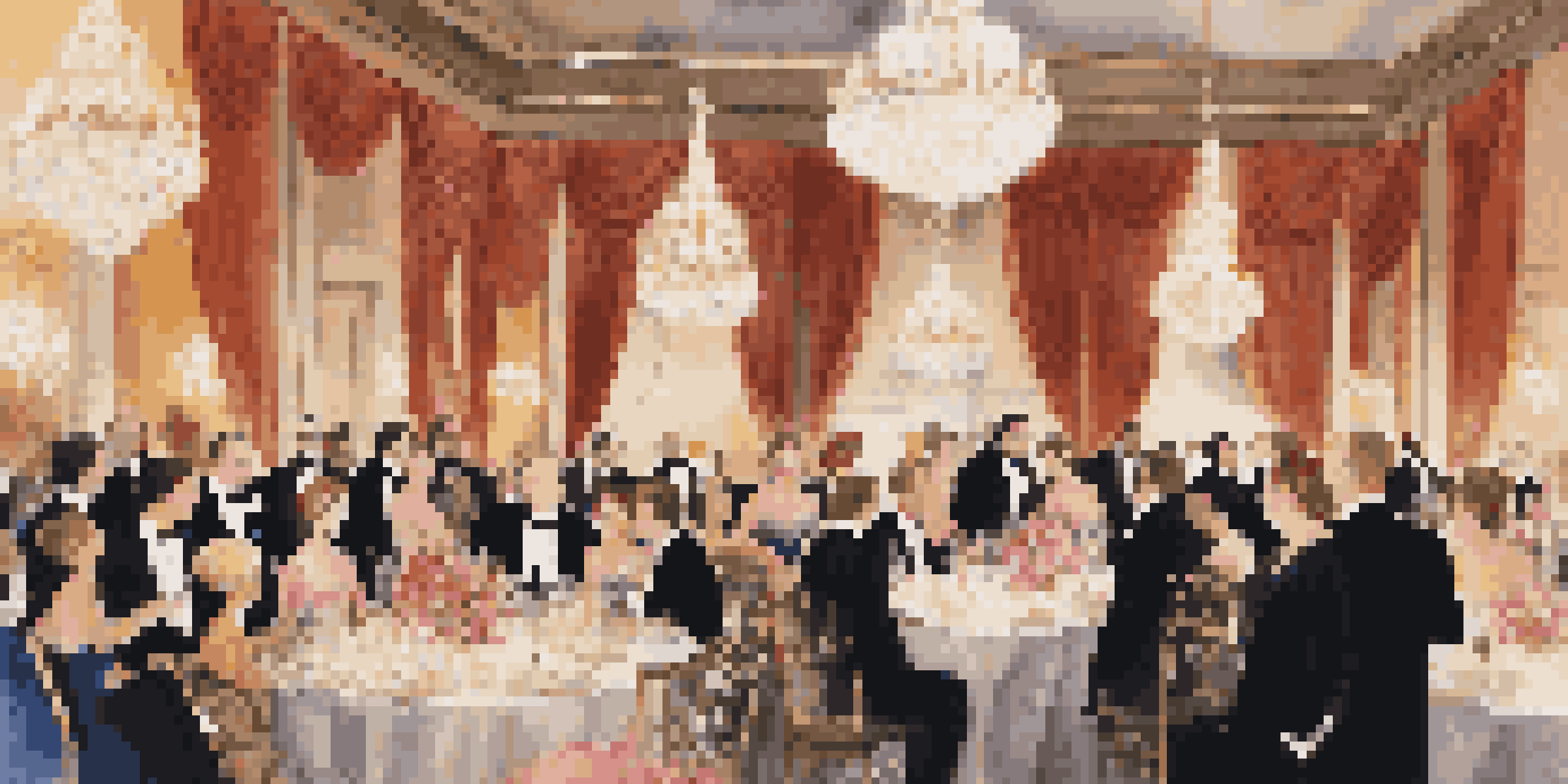 A grand charity ball featuring elegantly dressed guests dancing and socializing under crystal chandeliers in a beautifully decorated ballroom.