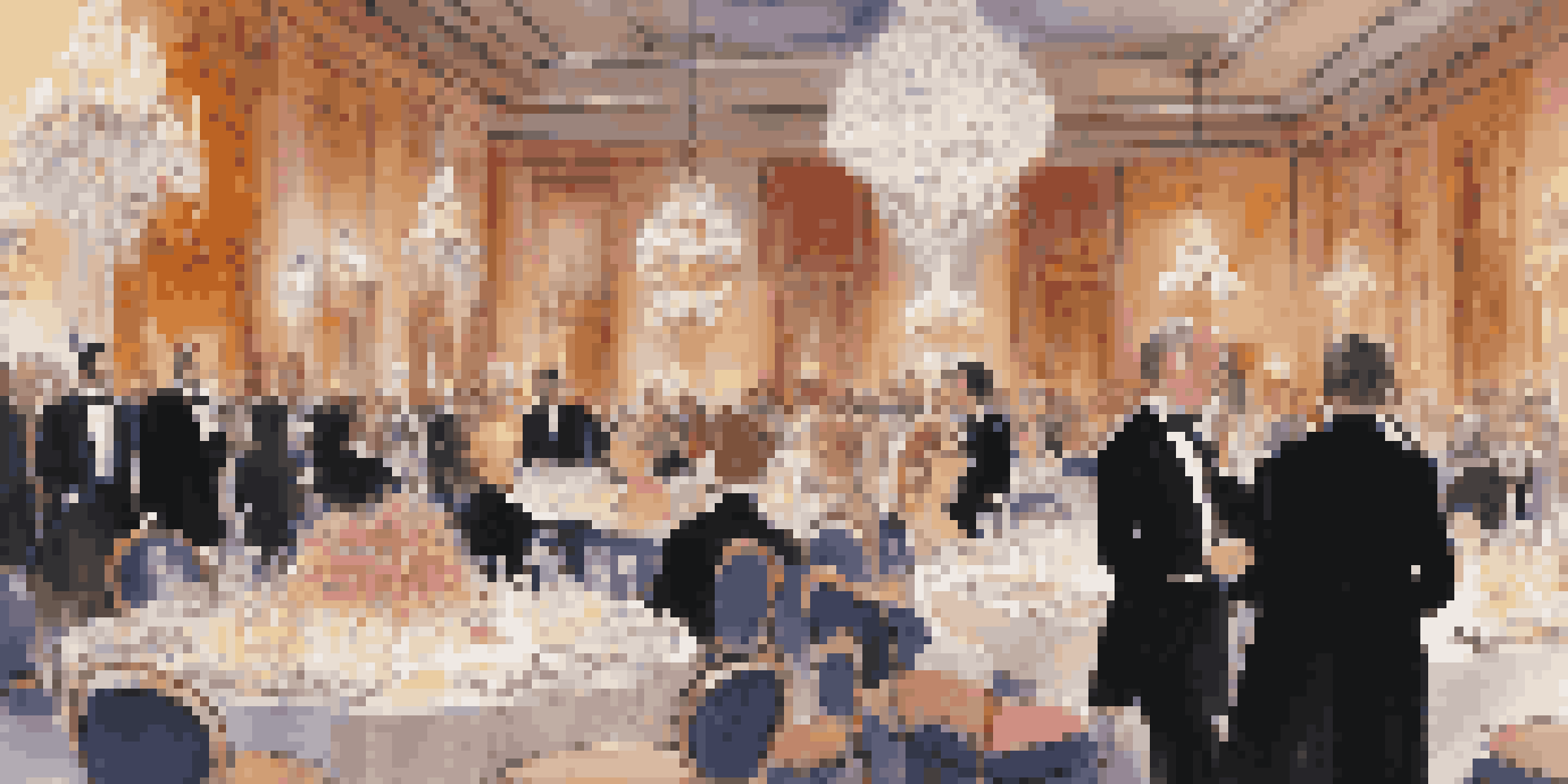 A vibrant charity gala with well-dressed guests, elegant decorations, and a dining table set with fine china and crystal glasses.