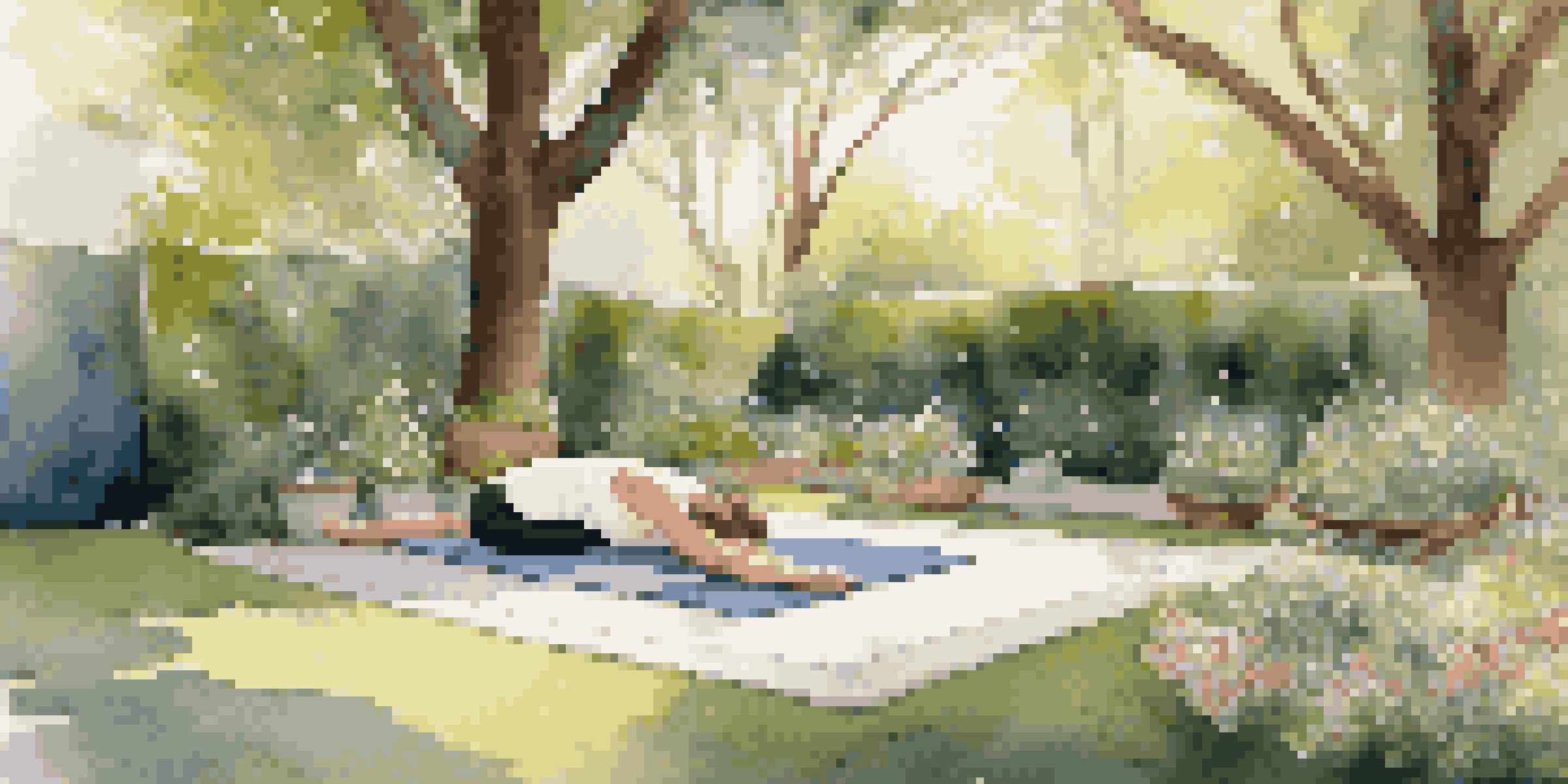 An inviting outdoor yoga space with a yoga mat on grass, surrounded by flowers and trees, bathed in soft sunlight.