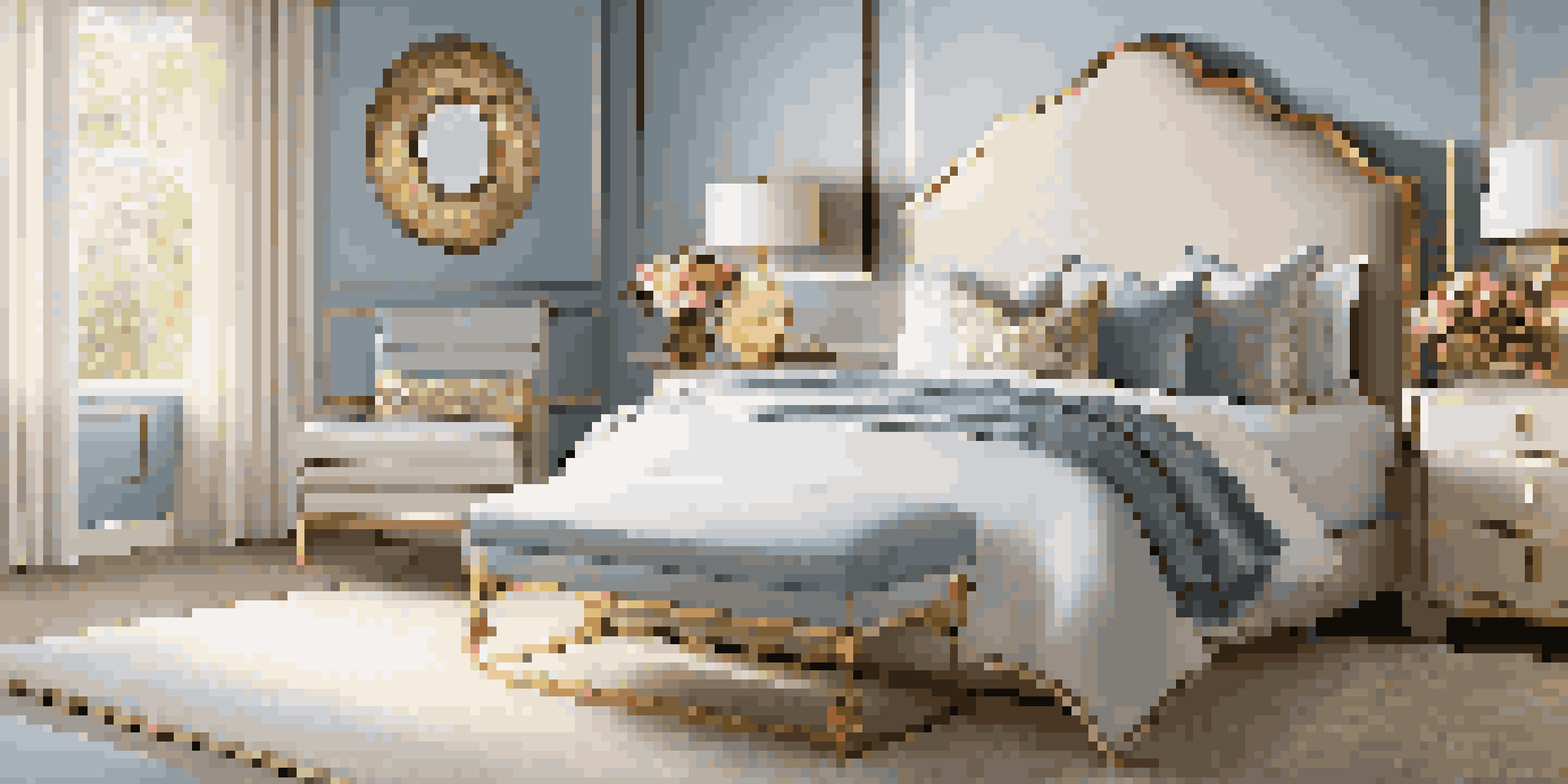 A peaceful bedroom with blue walls and gold accents, showcasing a handcrafted vase with flowers and warm lighting.