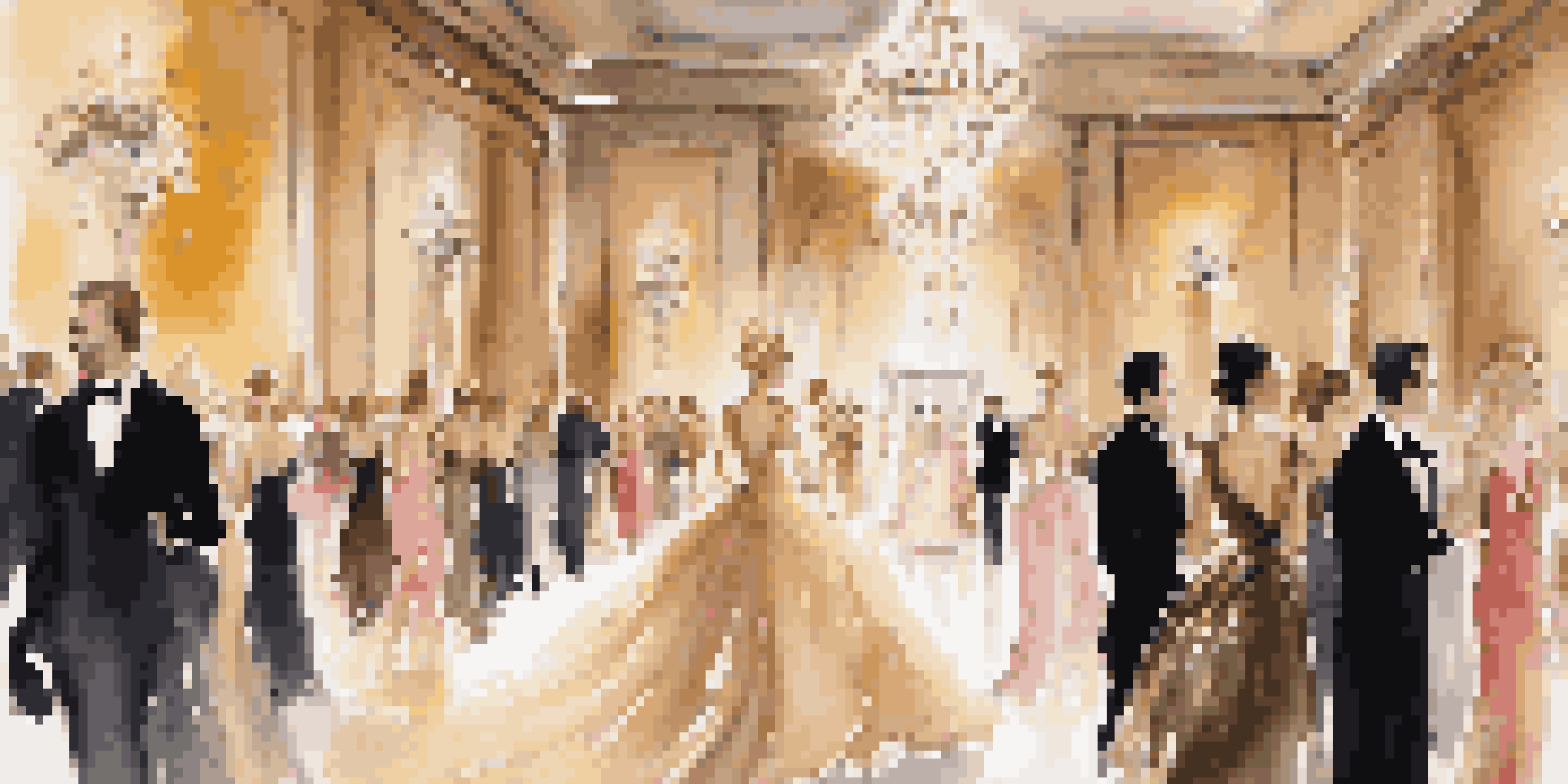 A fashion runway with models in elegant evening gowns, surrounded by floral arrangements and soft lighting.