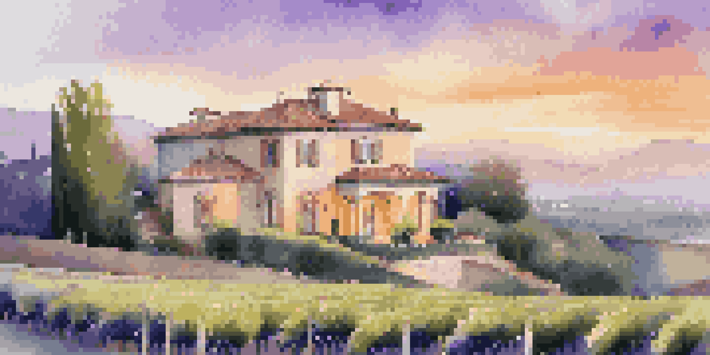 A luxurious villa with a view of a vineyard at sunrise, surrounded by blooming lavender flowers.