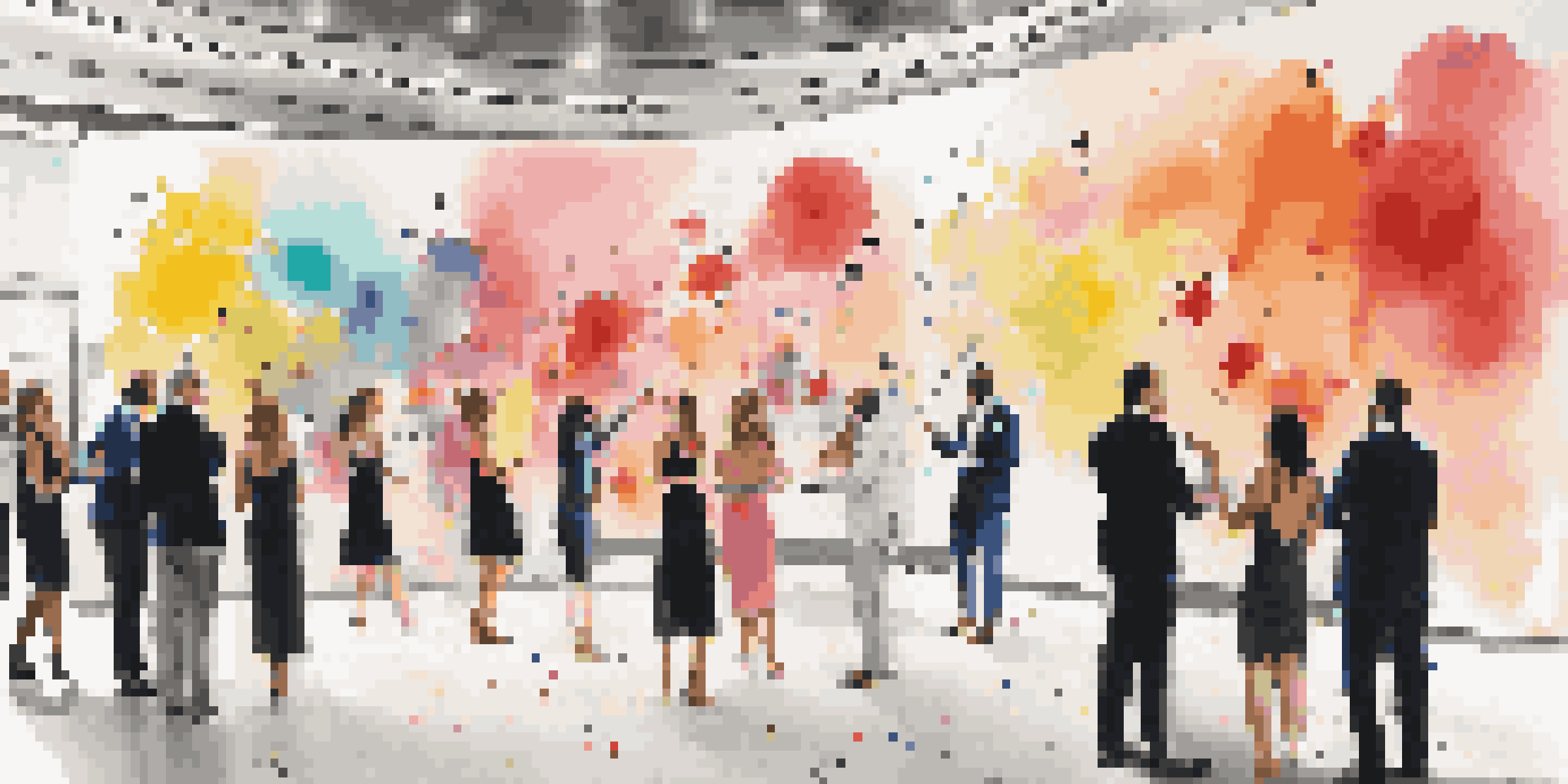 Guests painting a mural in an interactive art installation at a gala event.
