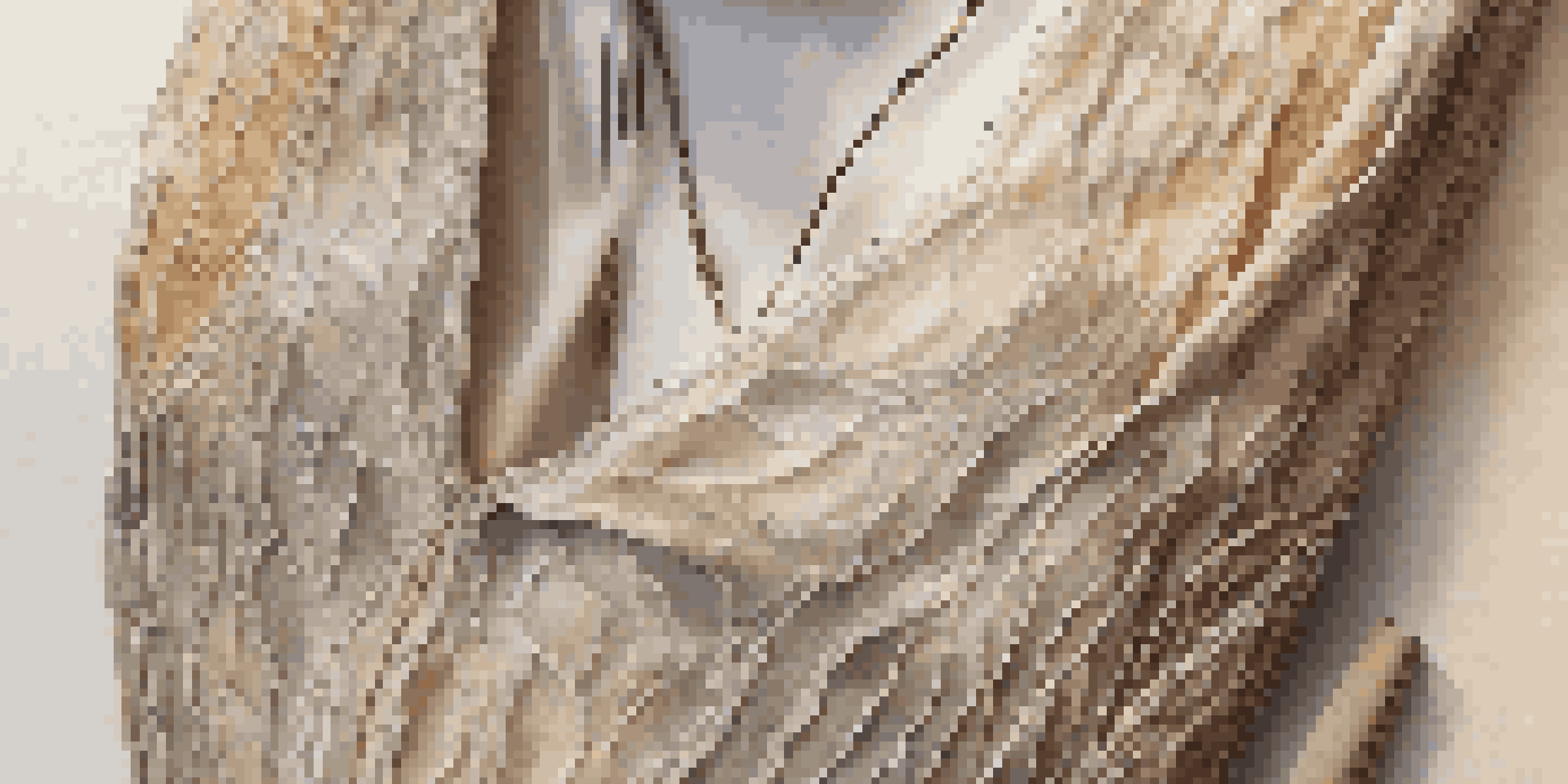 A close-up view of a luxury fashion item made from sustainable materials, displayed on a wooden surface with natural lighting.