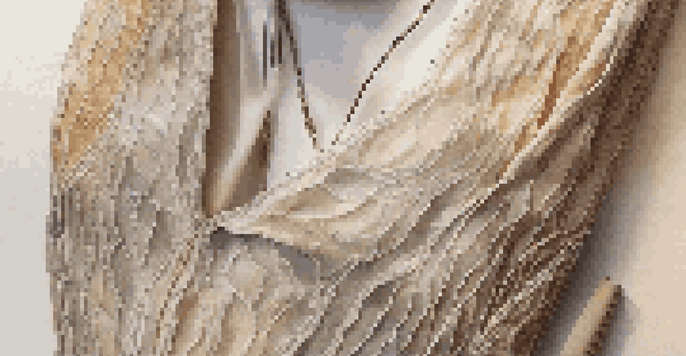 A close-up view of a luxury fashion item made from sustainable materials, displayed on a wooden surface with natural lighting.