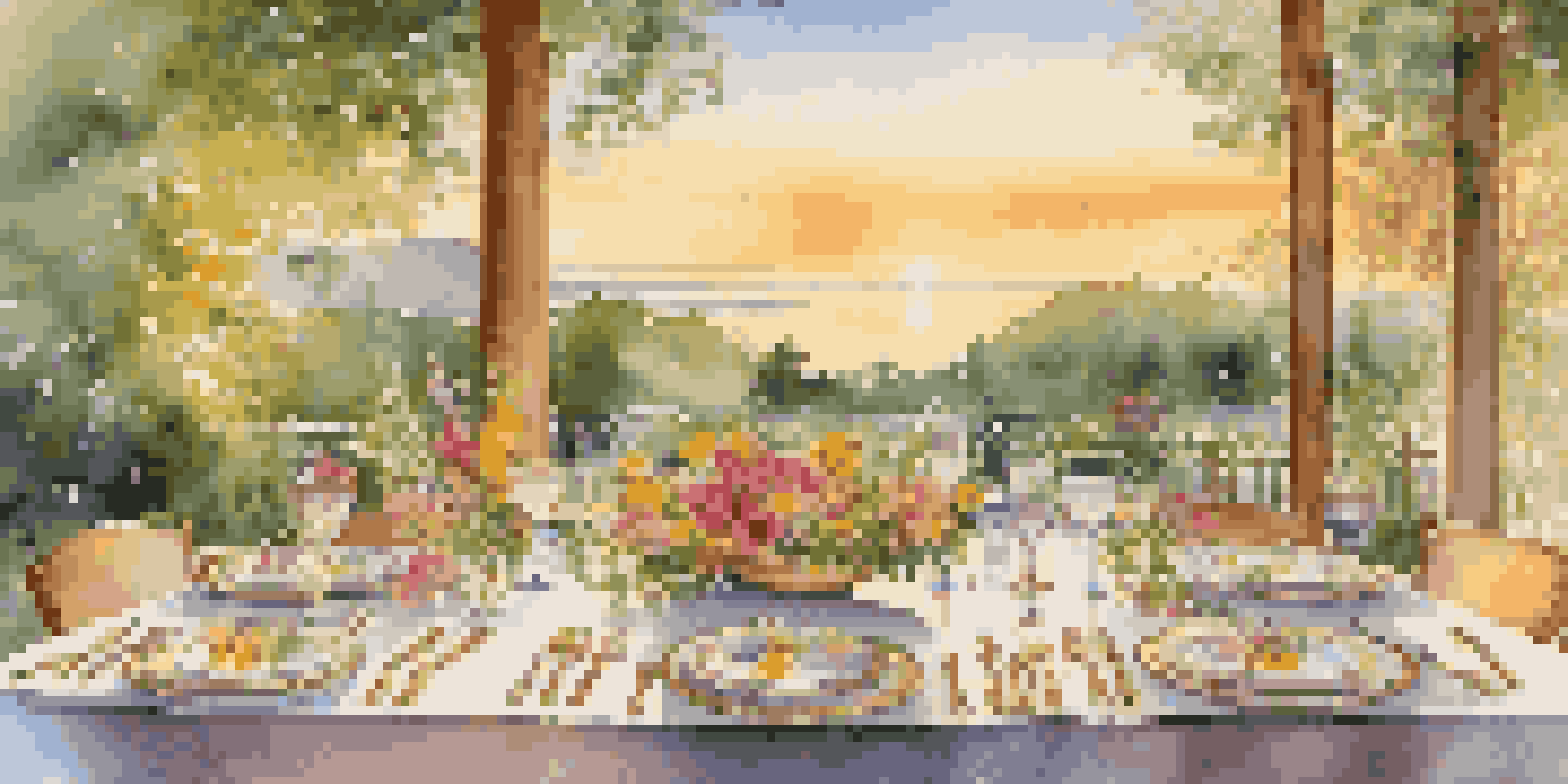An outdoor dining table elegantly set with gourmet dishes, crystal glasses, and beautiful flowers, illuminated by sunset light.