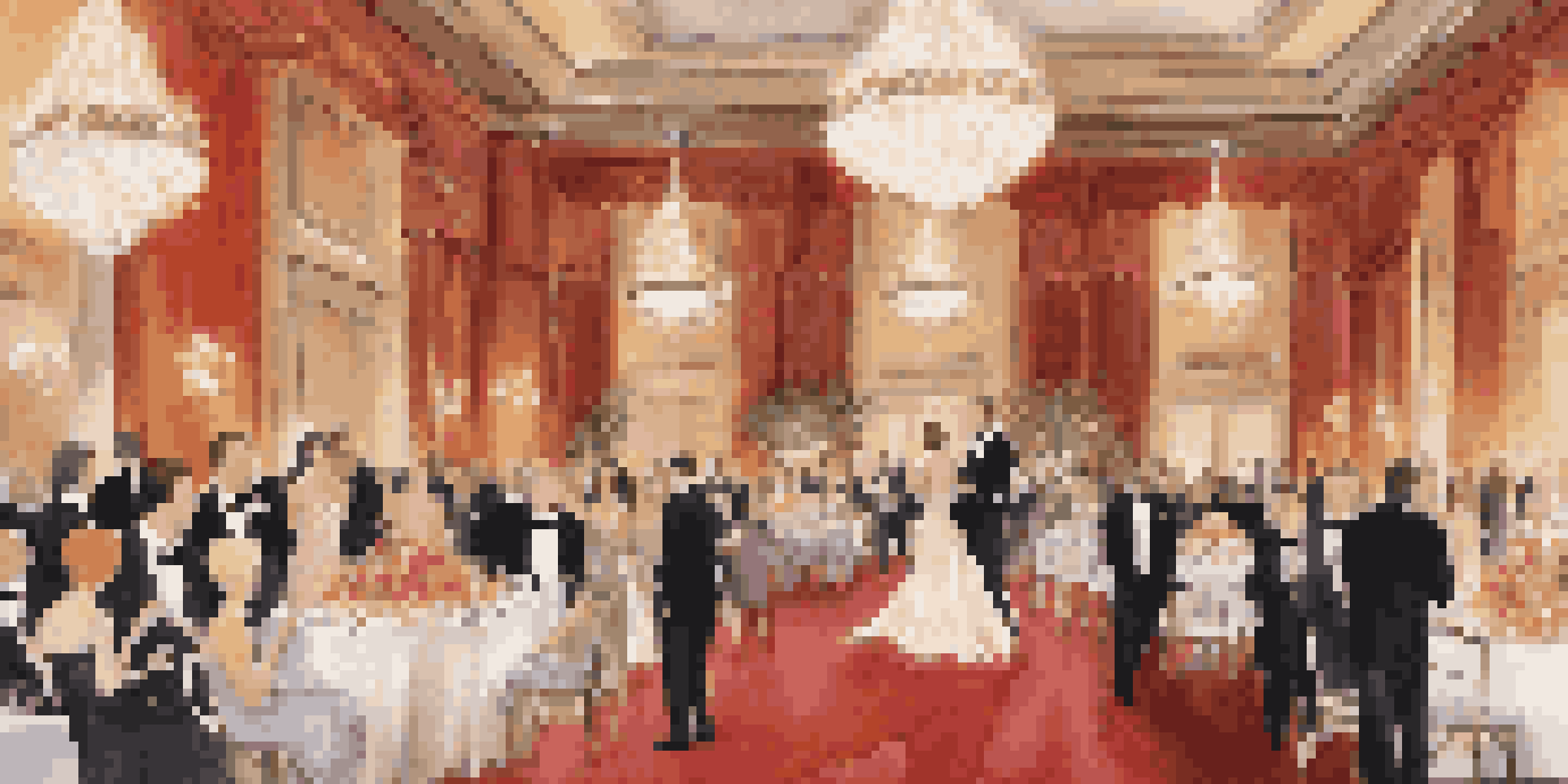 A luxurious ballroom decorated with chandeliers and flowers, with guests in formal wear enjoying the event.