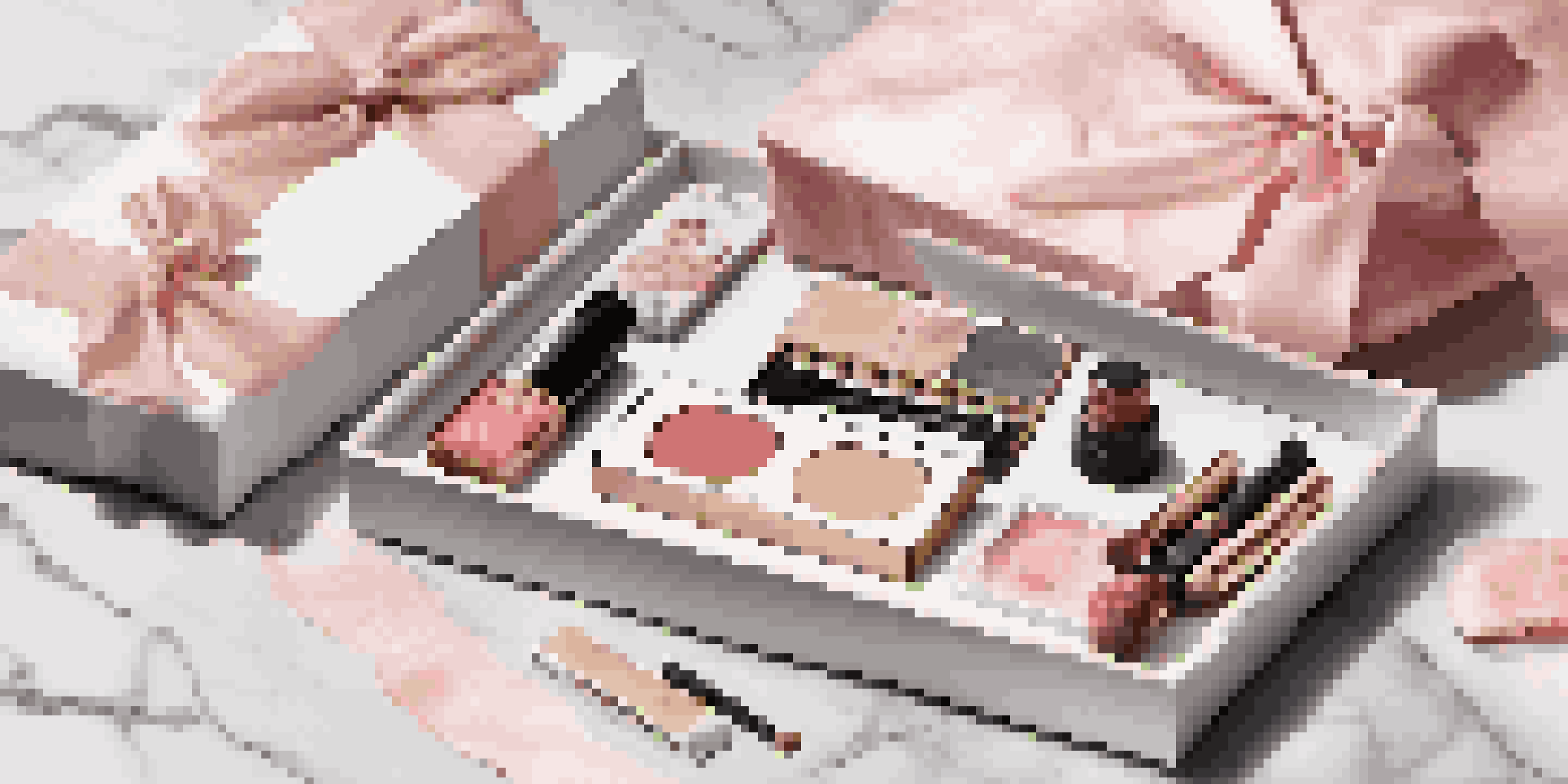 A luxury subscription box filled with high-end beauty products displayed on a marble countertop under soft lighting.