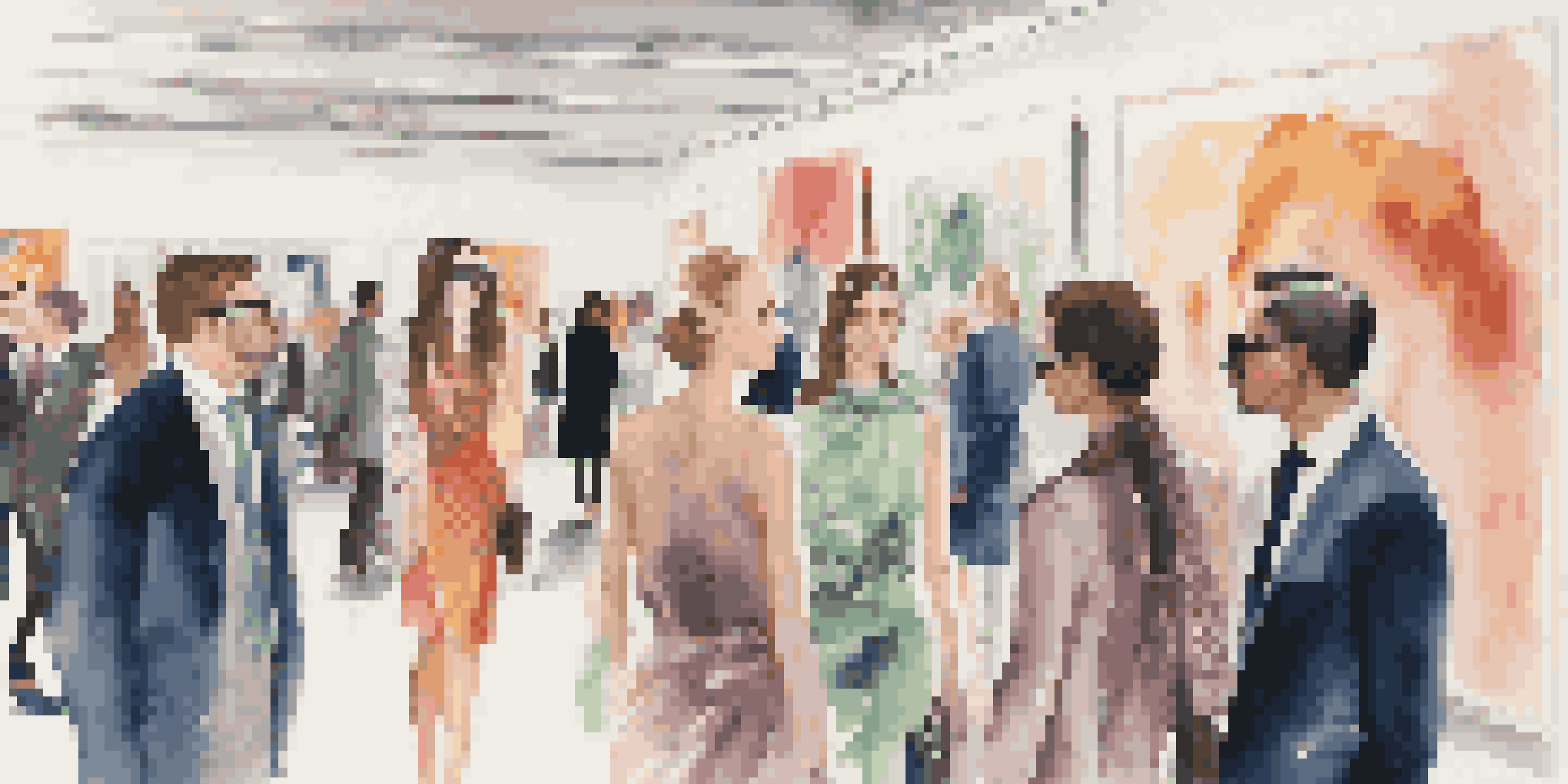 A lively fashion critique event with people in elegant attire discussing luxury fashion in a modern venue.