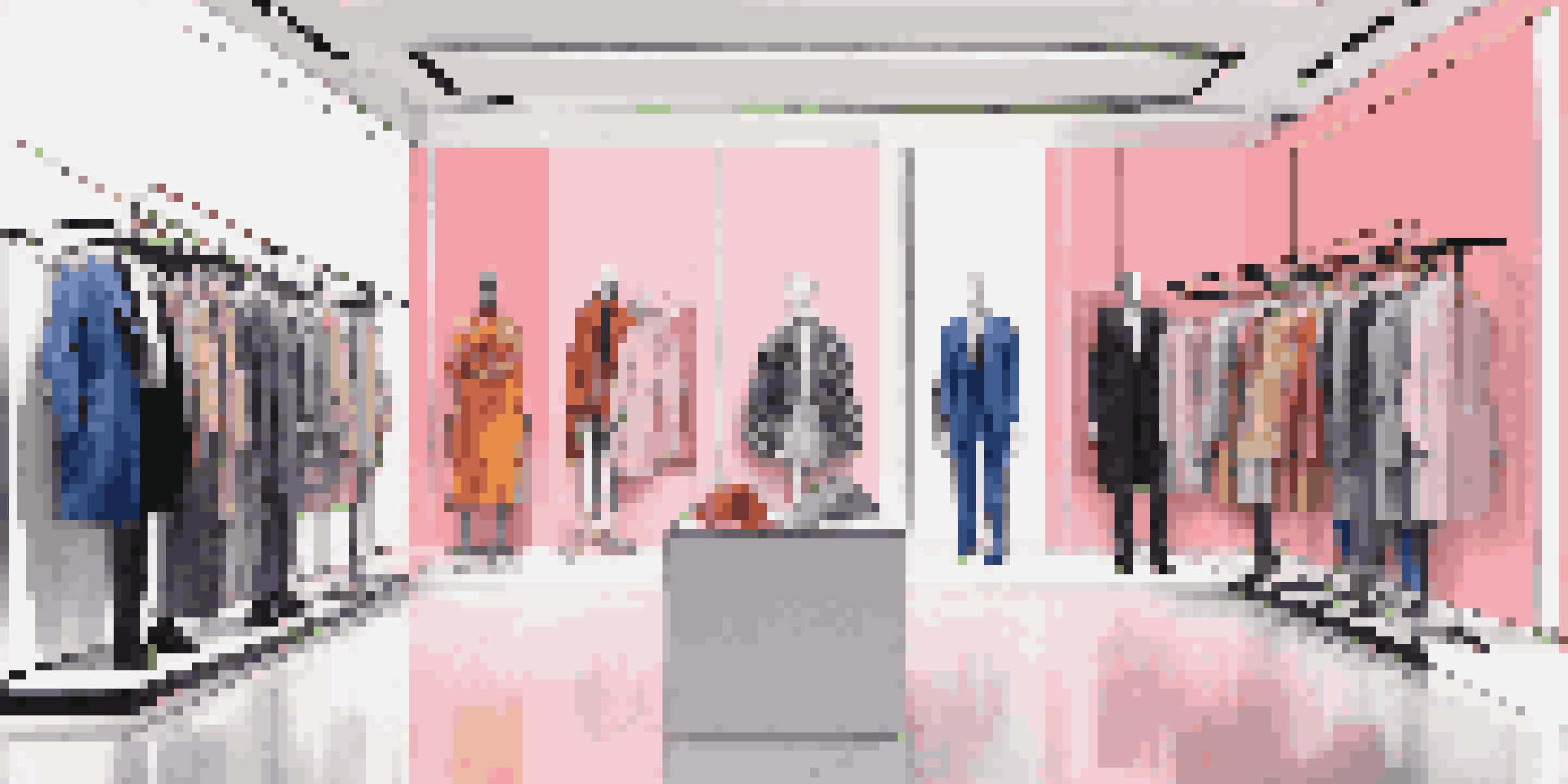 A modern boutique showcasing a blend of high-end fashion and streetwear, with colorful garments on mannequins in soft lighting.
