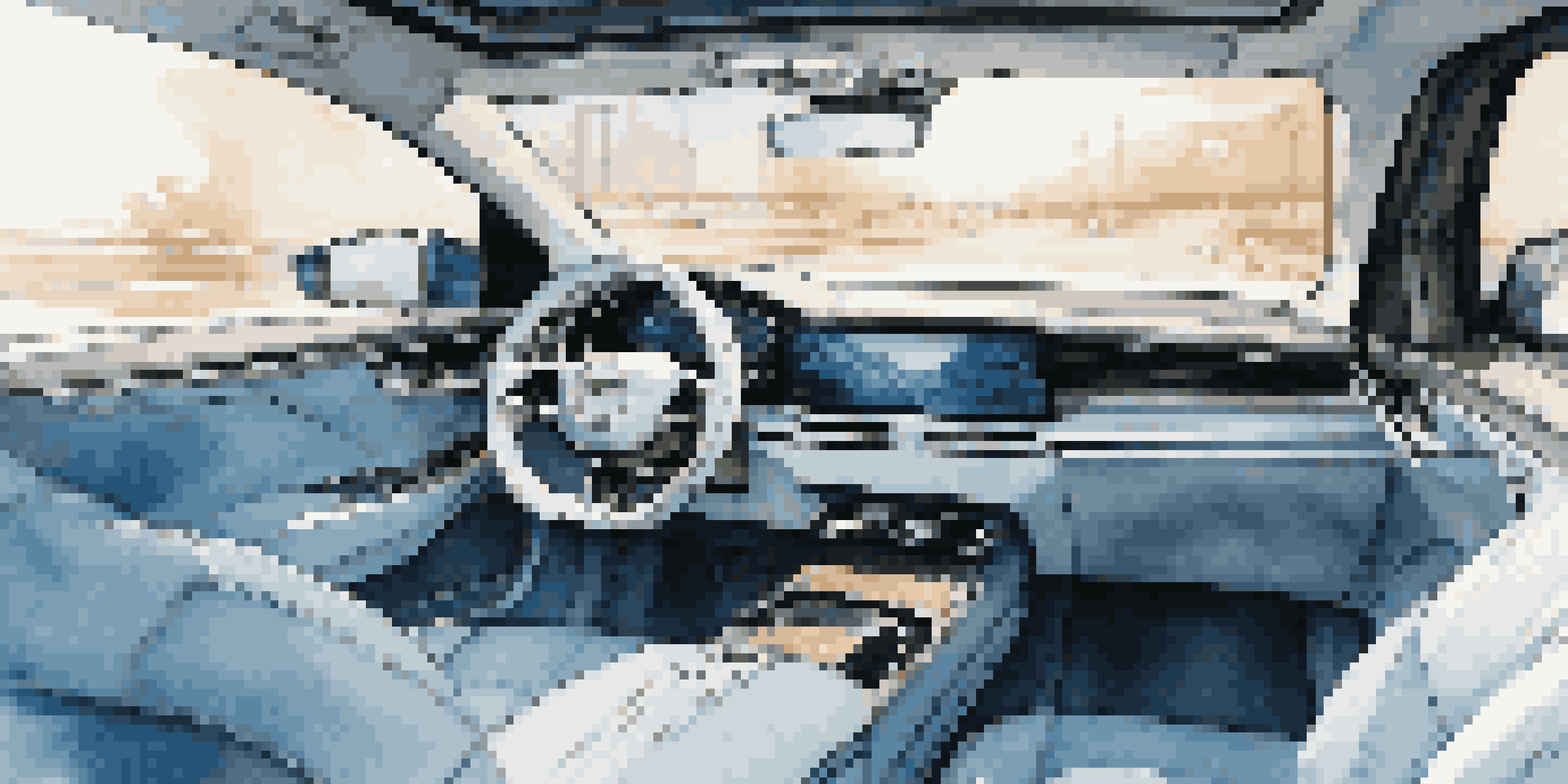 A luxurious car interior with smart materials that change color, featuring plush seating and ambient blue lighting.