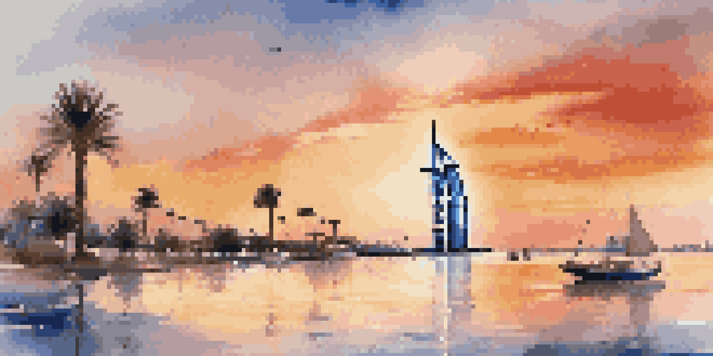 A sunset view of the Burj Al Arab hotel on its own island, with colorful skies and calm waters reflecting the hotel's silhouette.