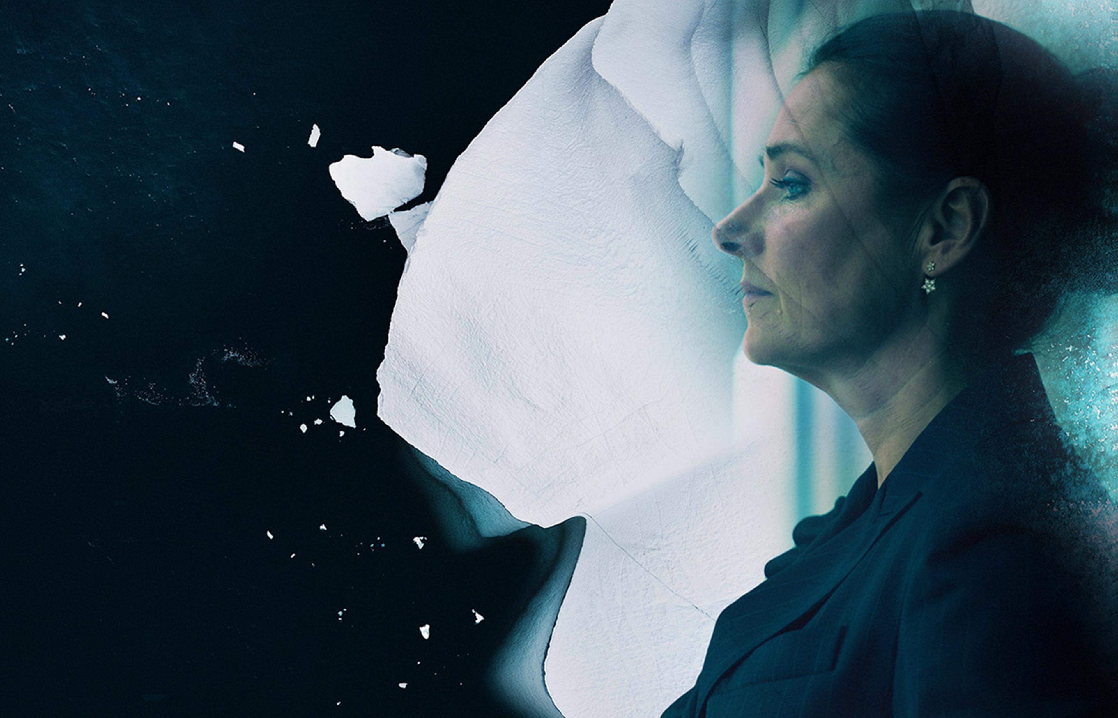 woman on ice looking at sea