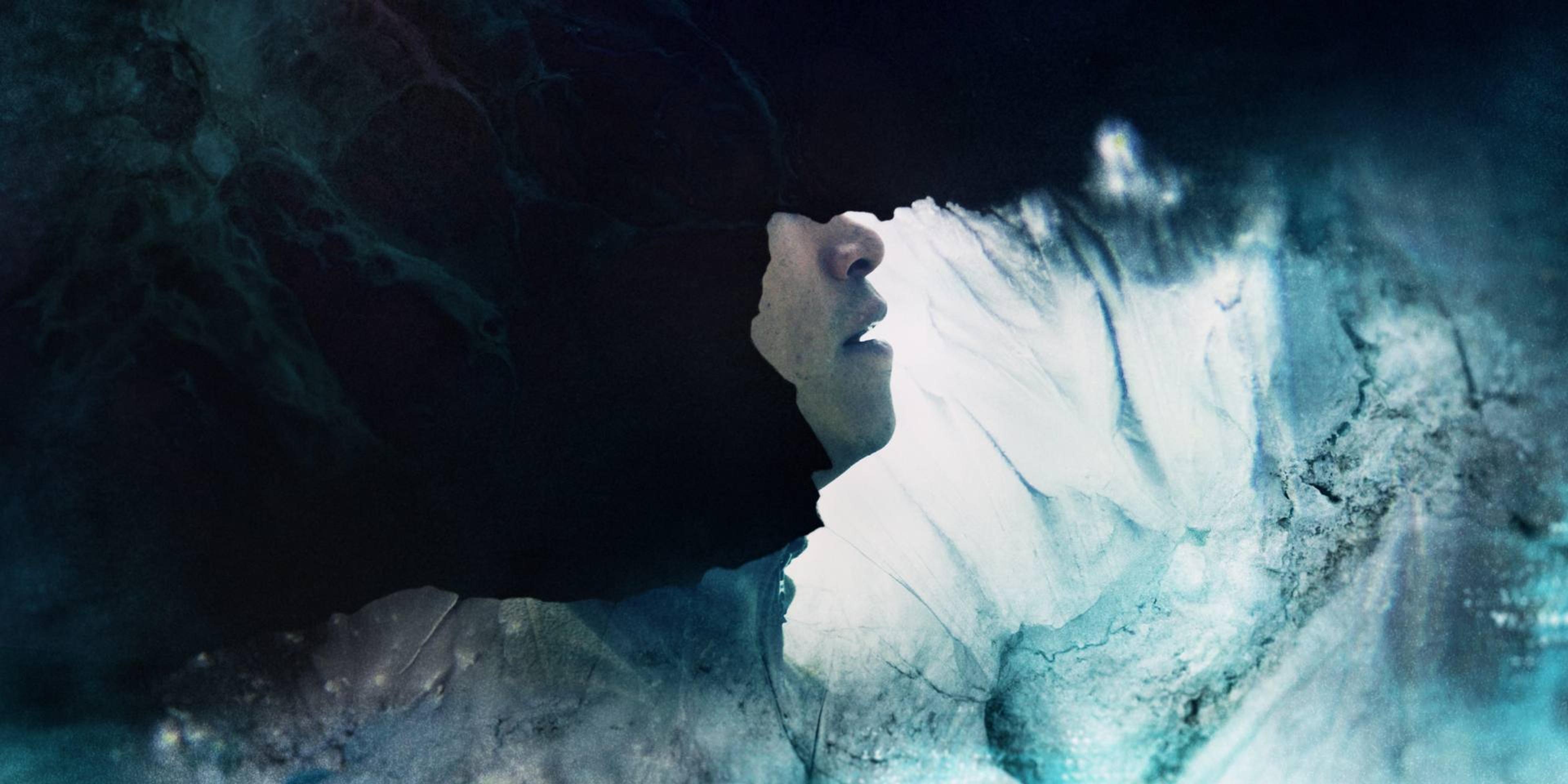 face hidden behind oil spill on ice