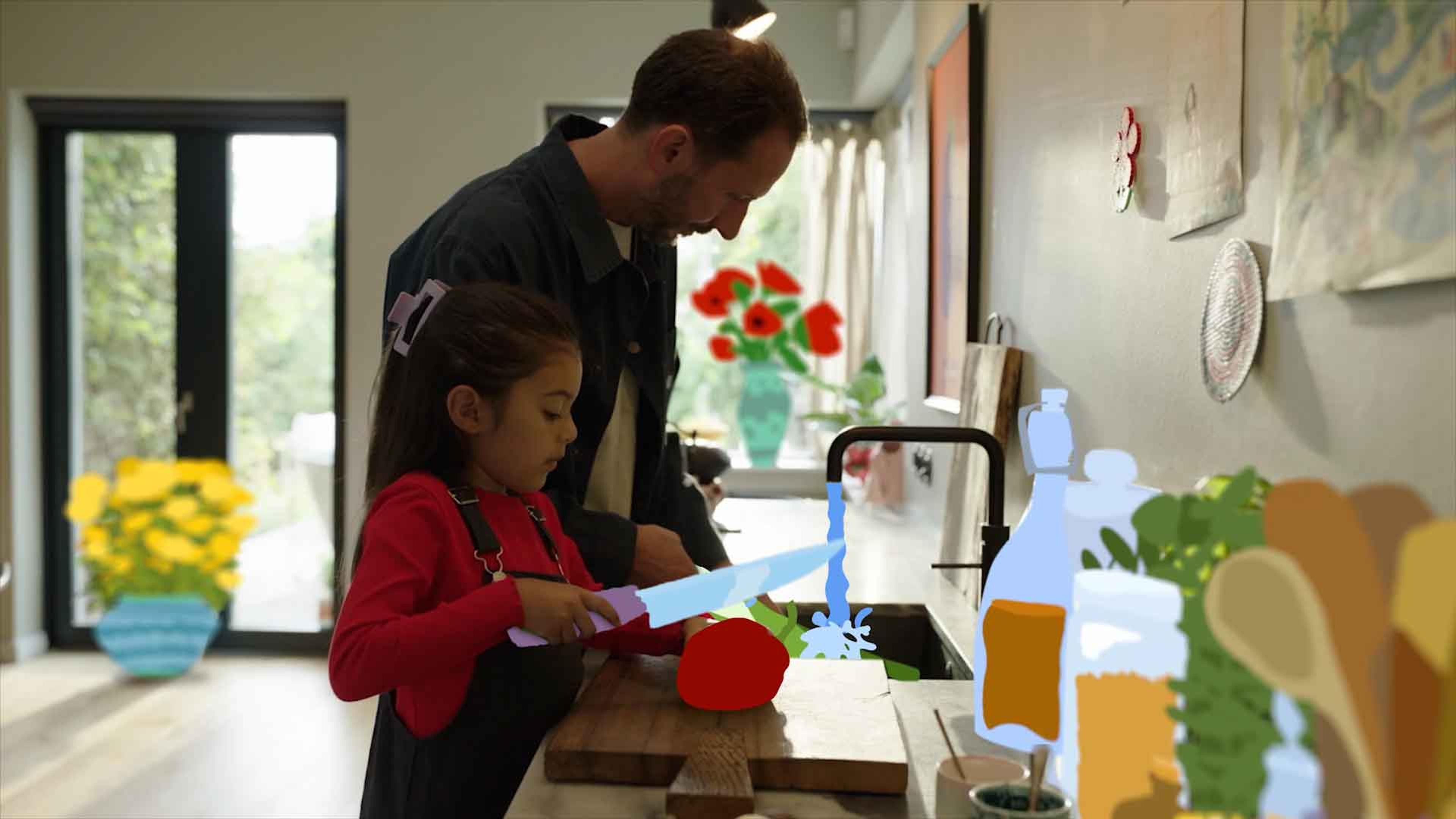 father and daughter cutting vegetables