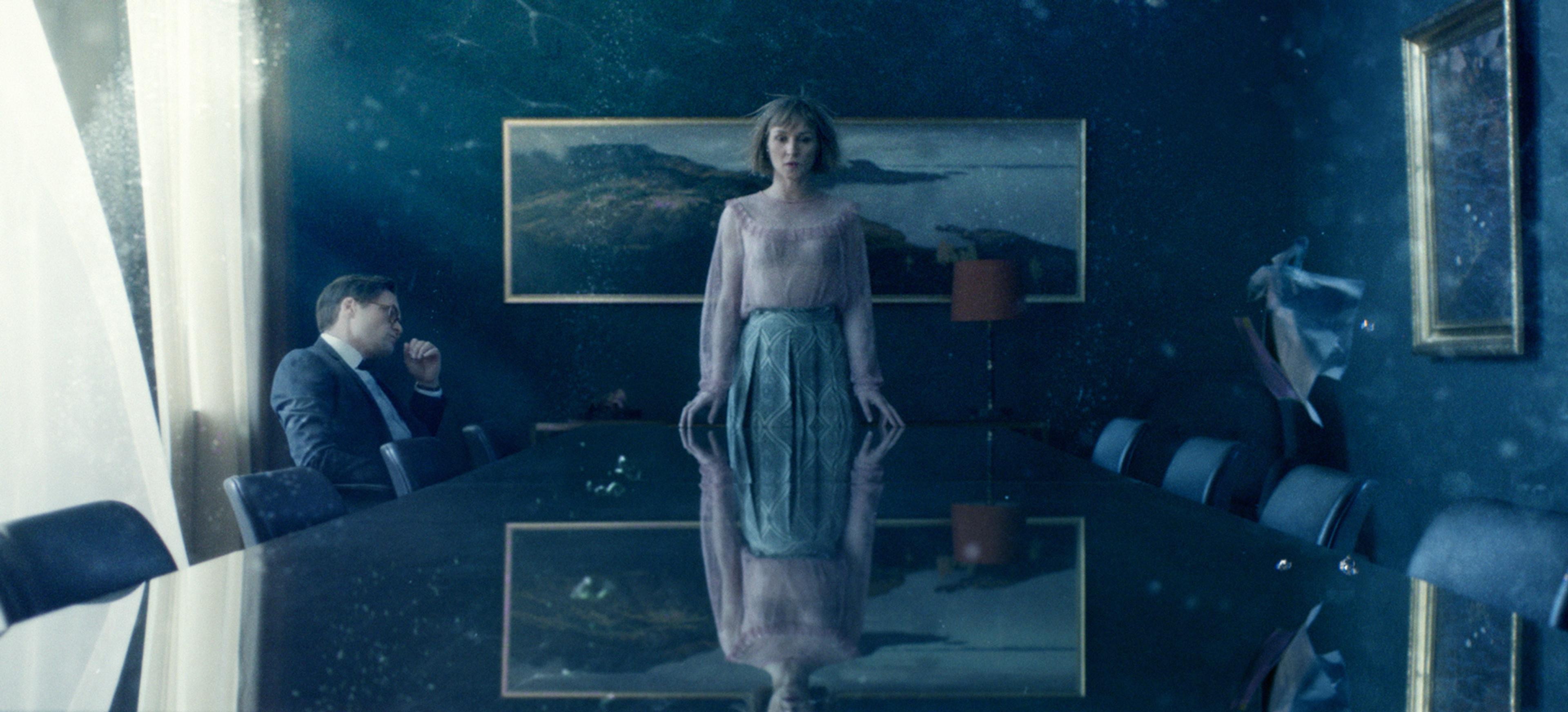 Woman in a conference room under water