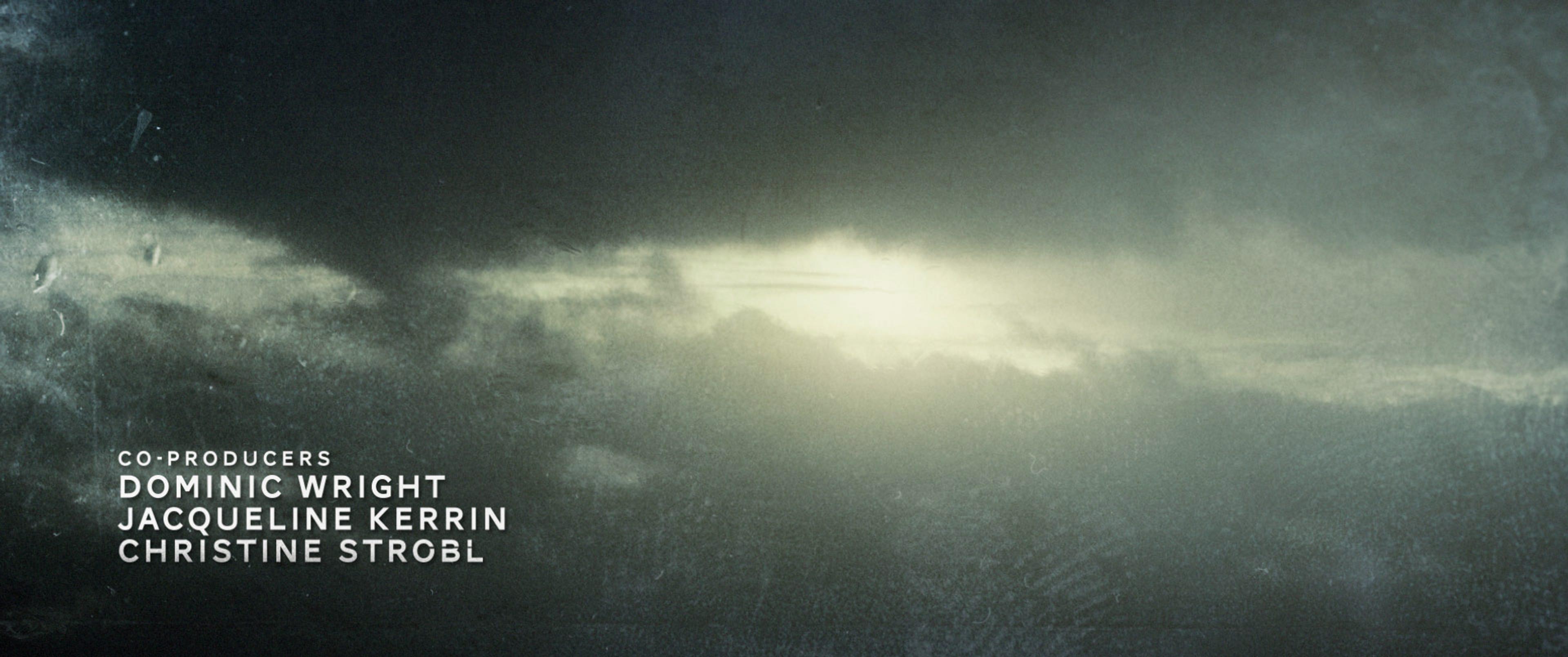 sun peaking out behind rainy clouds