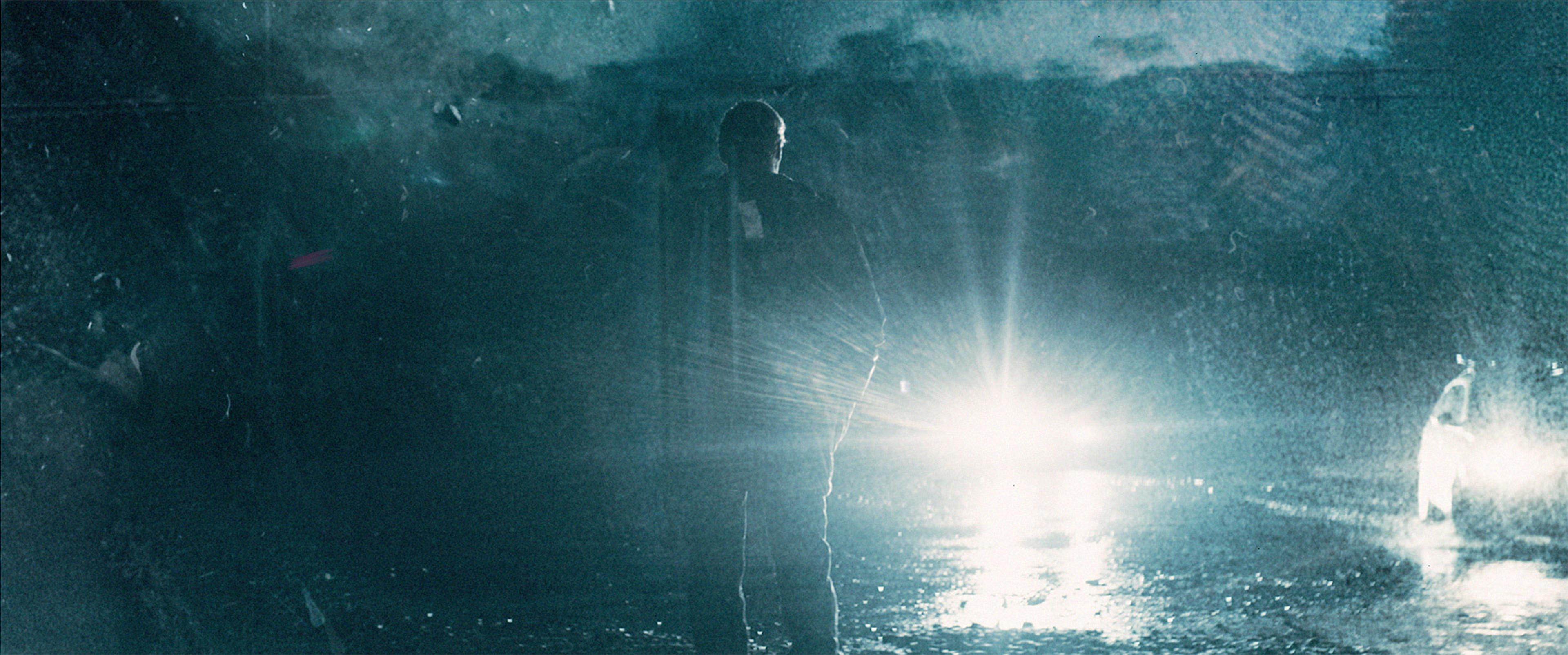 wisting standing in rainy night, from season 2 title sequence