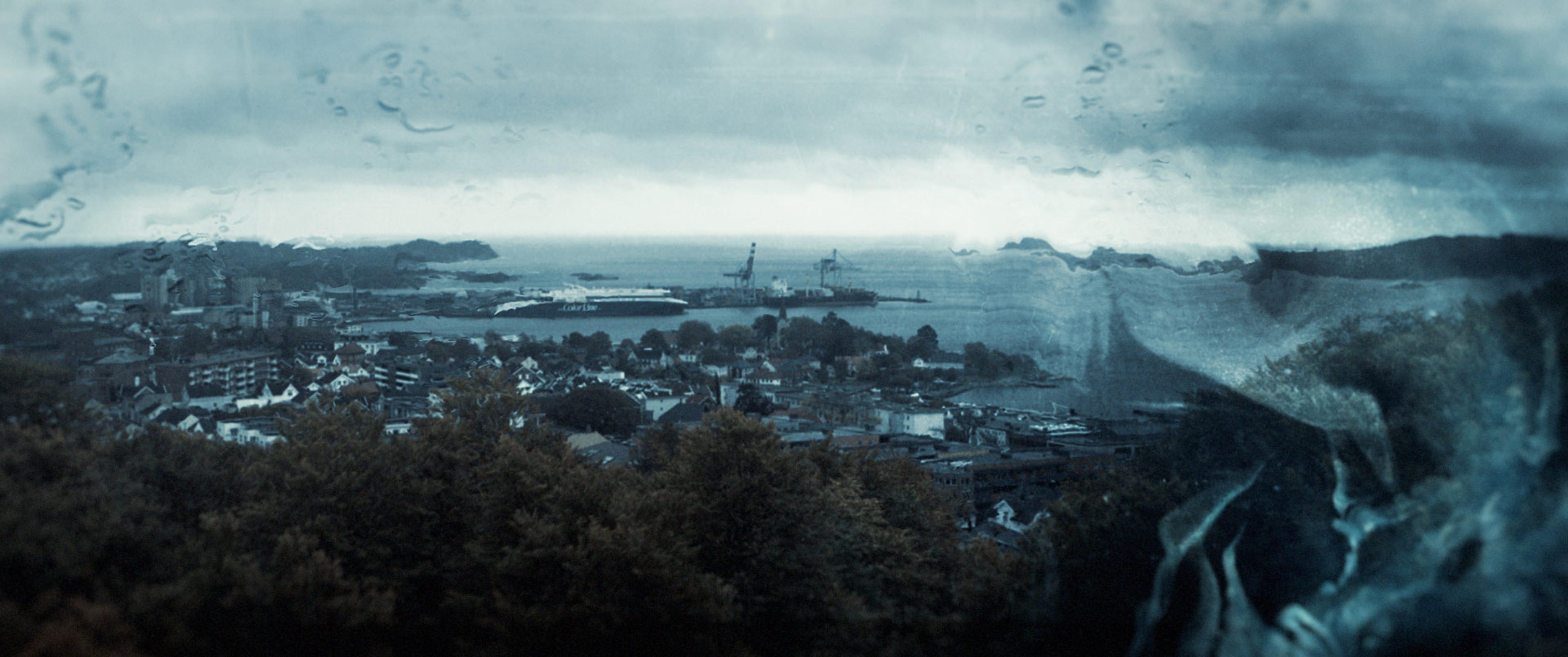 norwegian town cityscape with rainy graphic overlay
