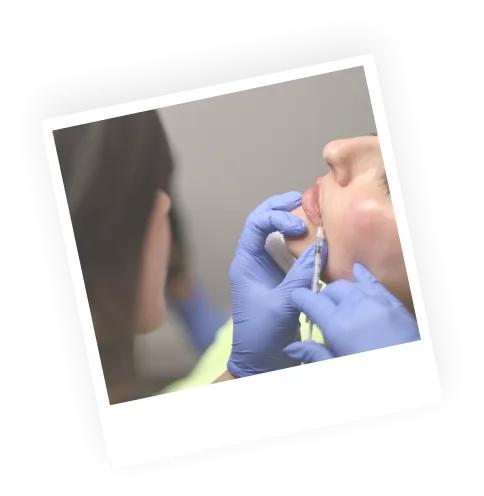 Registered nurse injector performing injectable medical aesthetics on patient in lip area - Deja You Medical