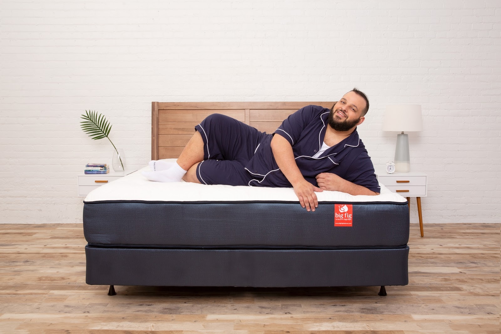 man laying on a big fig mattress