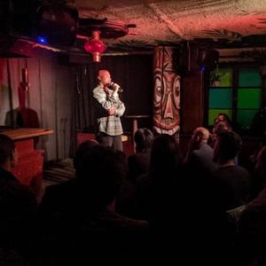 Matt in Switzerland. A picture of him performing in a bar, as well as a picture of him in the Swiss Alps!