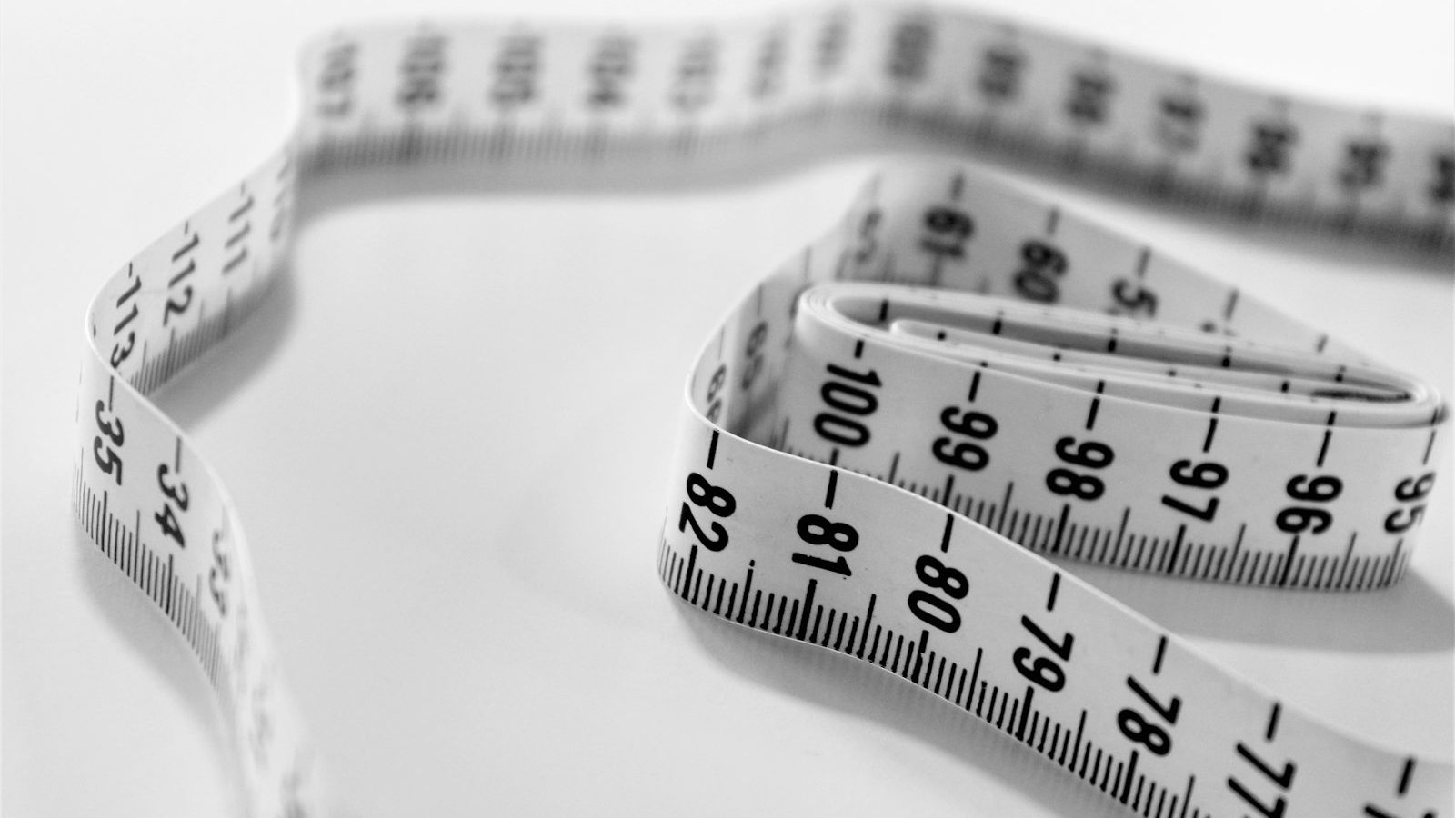 selective focus photography of tape measure