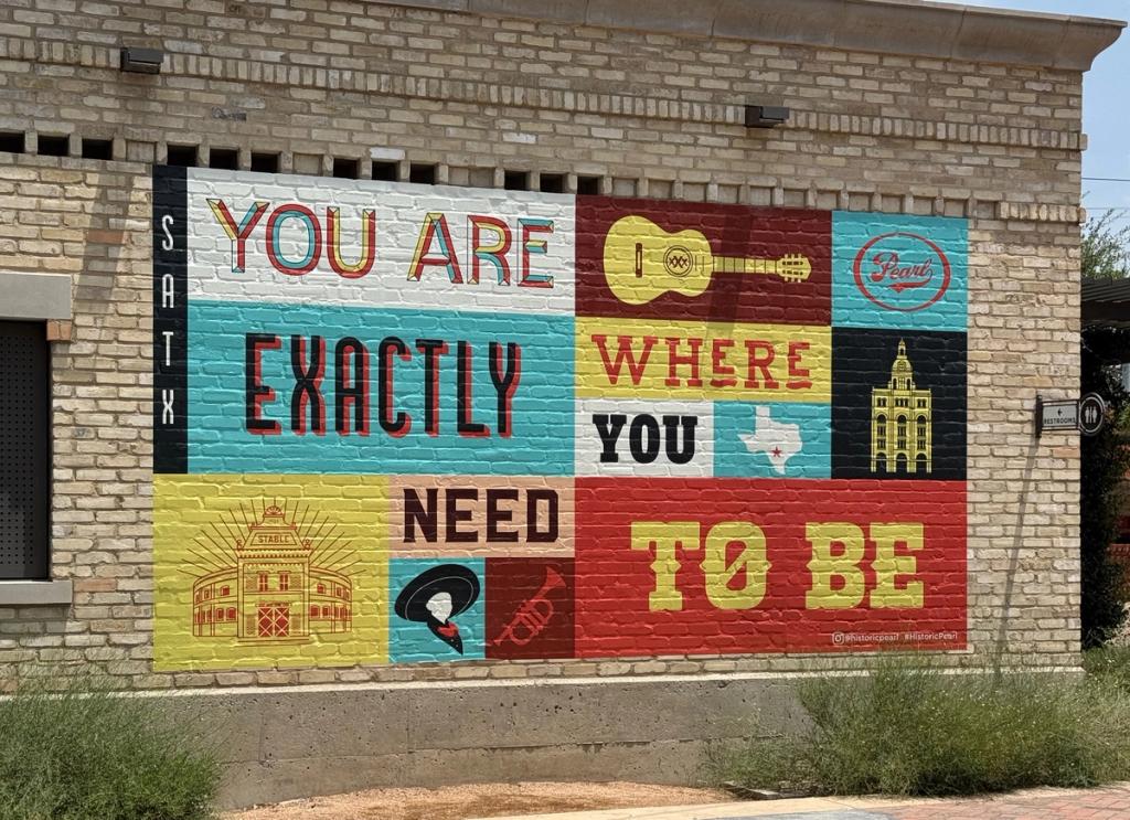 Mural on an exterior wall: You are exactly where you need to be