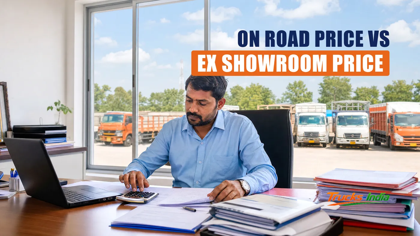 Truck buyer reviewing an on road price quotation at an Indian commercial vehicle dealership