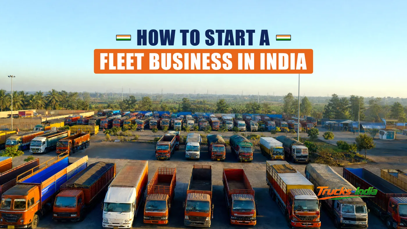 Fleet of commercial trucks parked in rows at an Indian yard