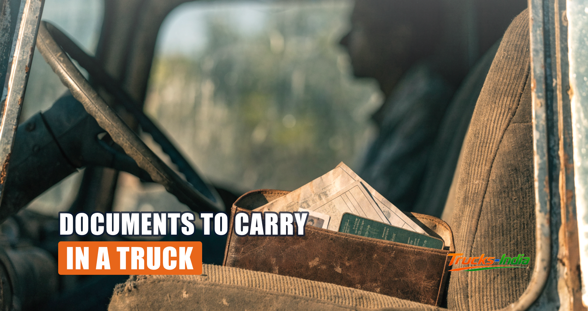 Truck driver holding a folder of vehicle documents beside the cab of an Indian goods vehicle