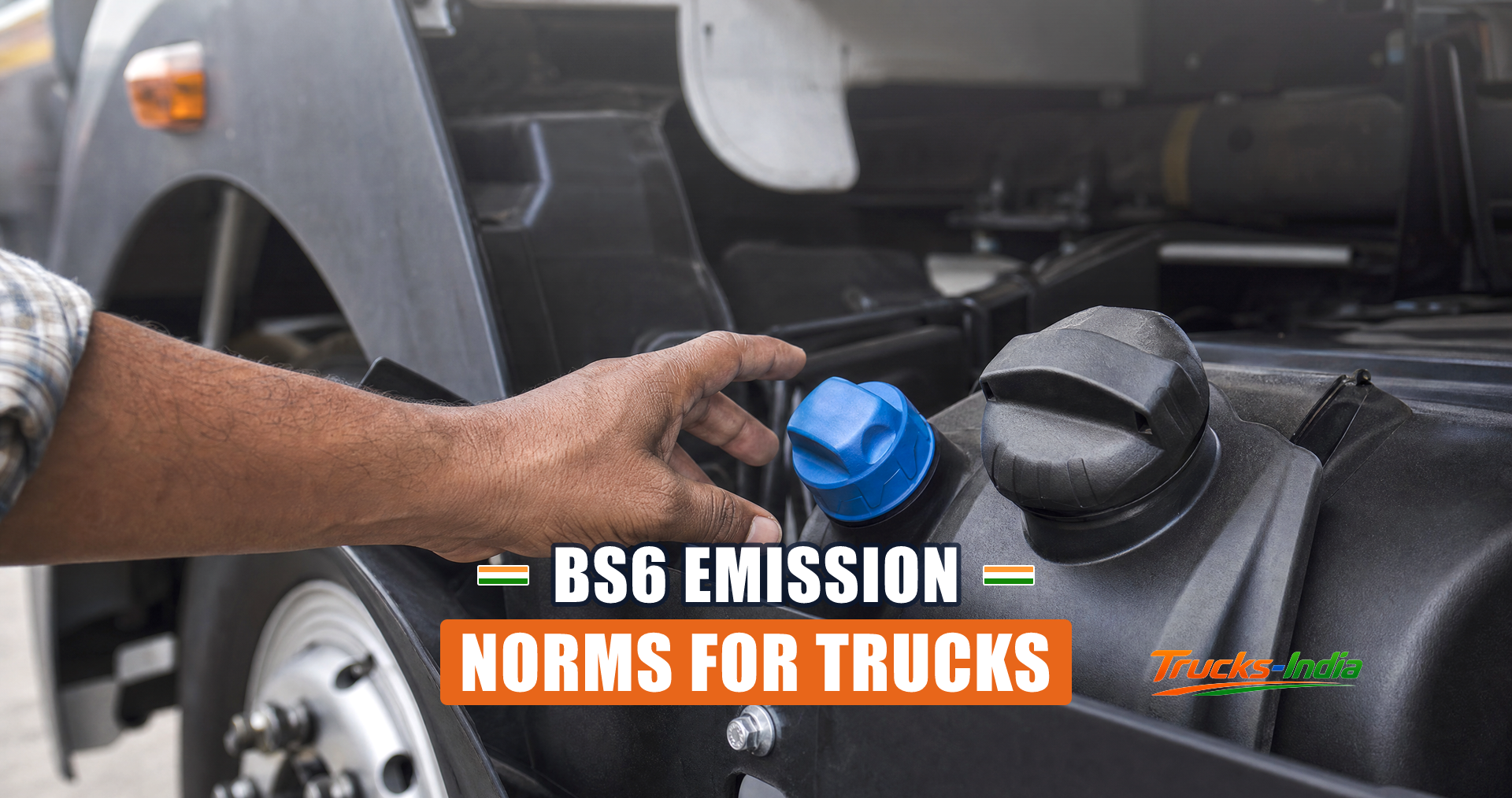 AdBlue filler cap beside the diesel tank on a BS6 Indian commercial truck