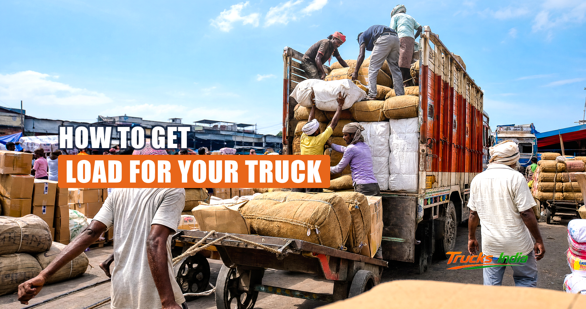 Trucks loading at an Indian warehouse dock