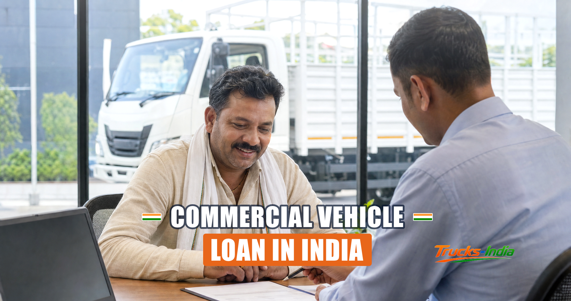 Truck owner reviewing commercial vehicle loan paperwork at an Indian dealership