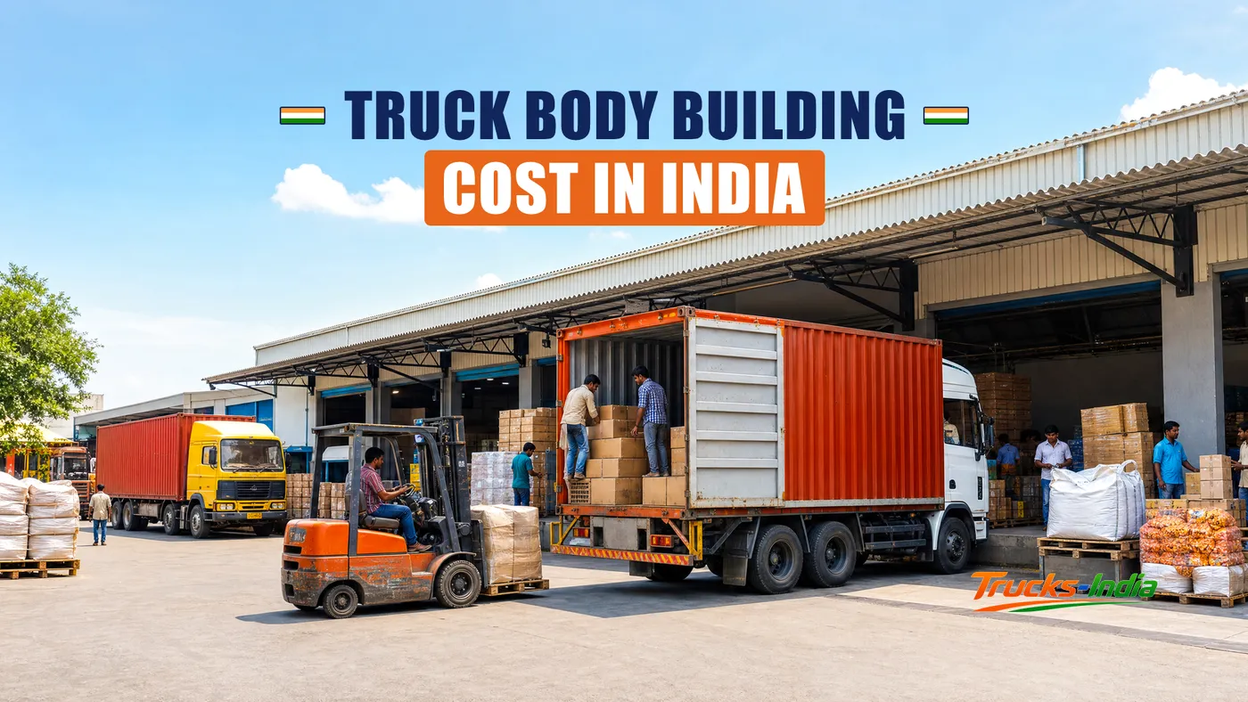 Fabricators building a steel load body onto a truck chassis at an Indian workshop