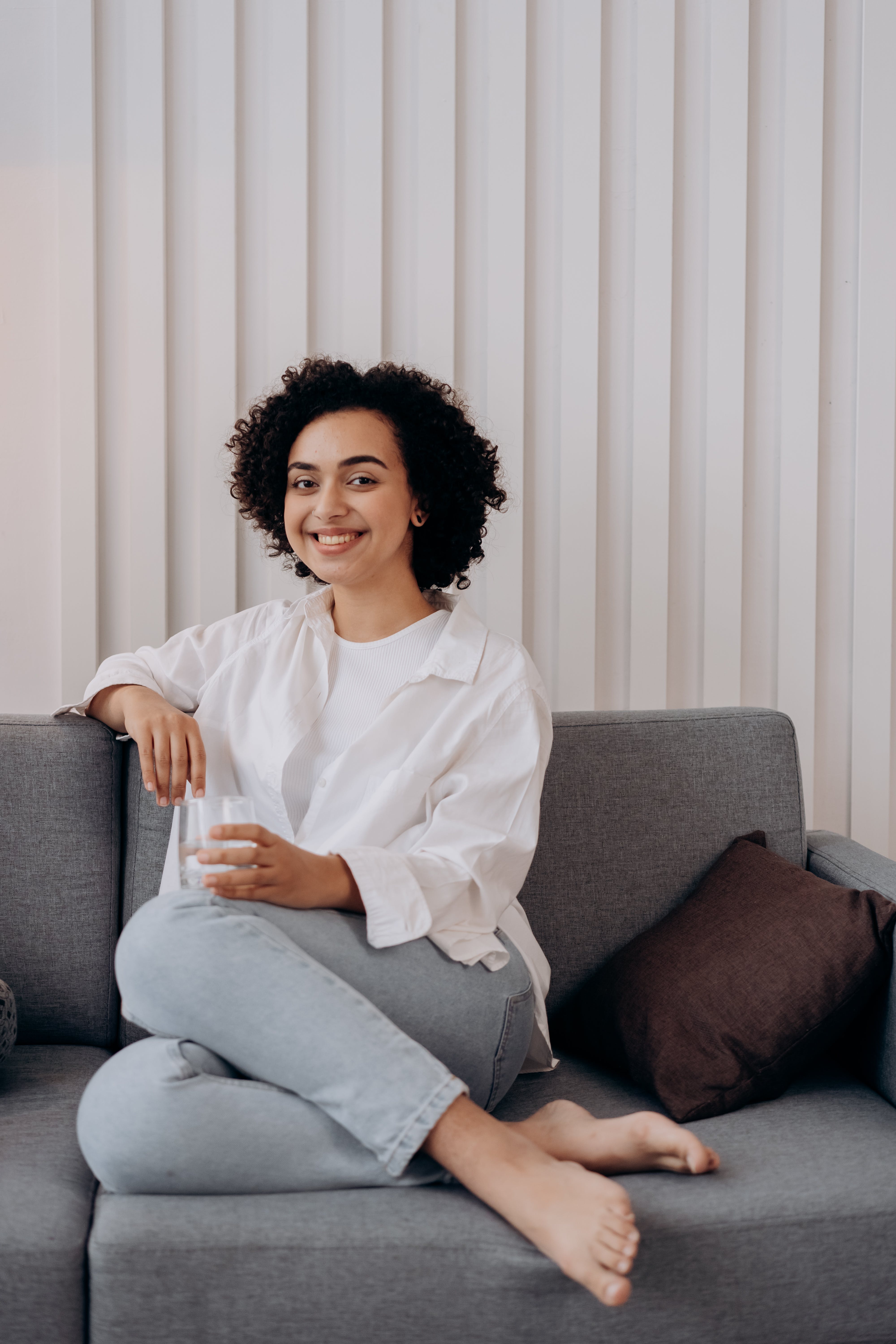 Happy woman drinks protein shake