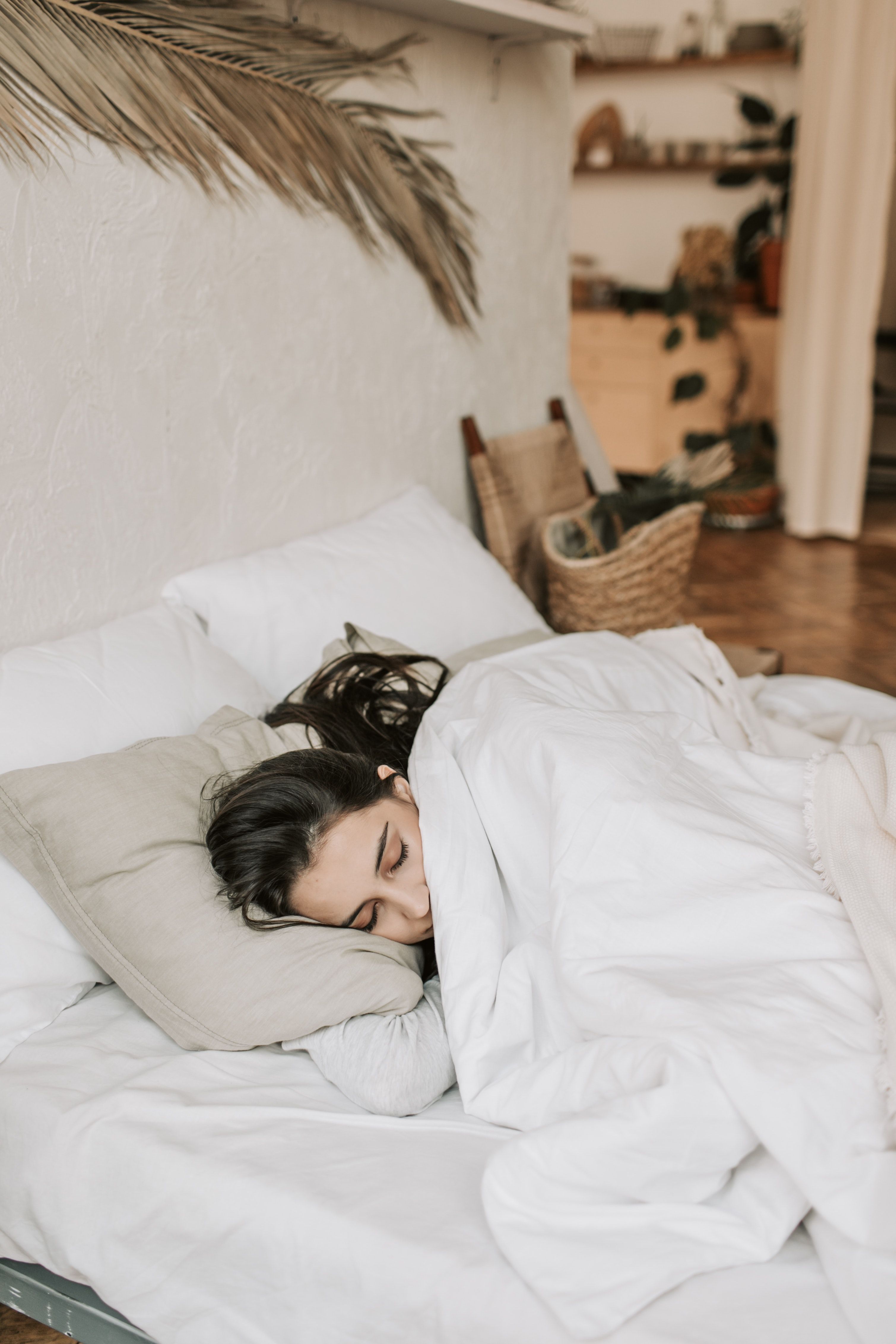 Woman sleeps in bed