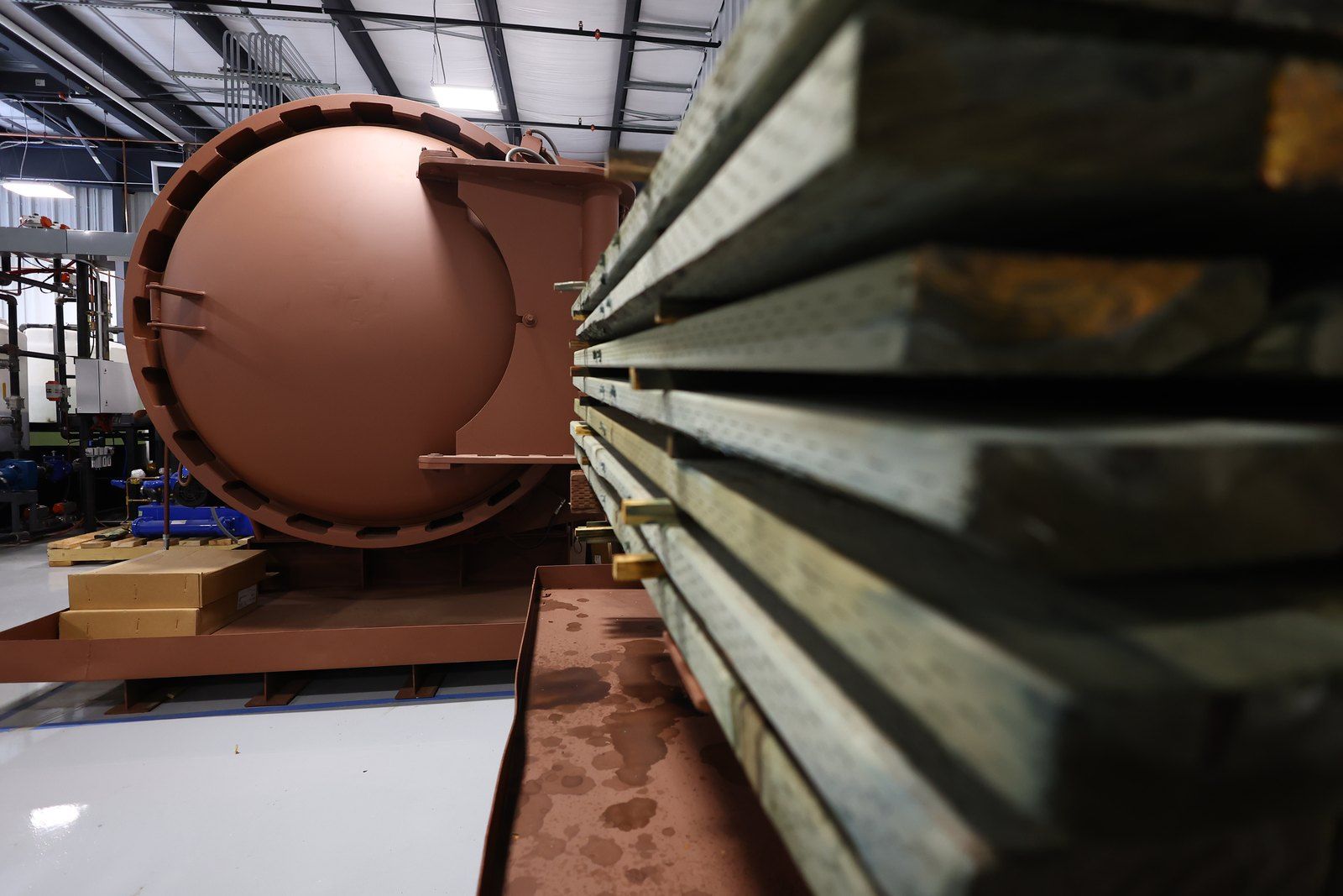 Copper-toned treatment cylinder on the plant floor