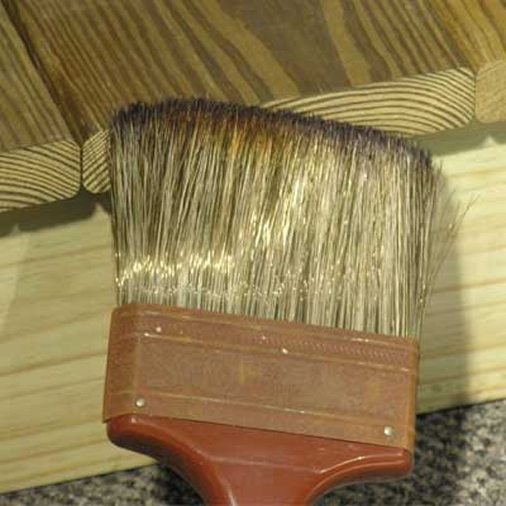 Paint brush applying preservative