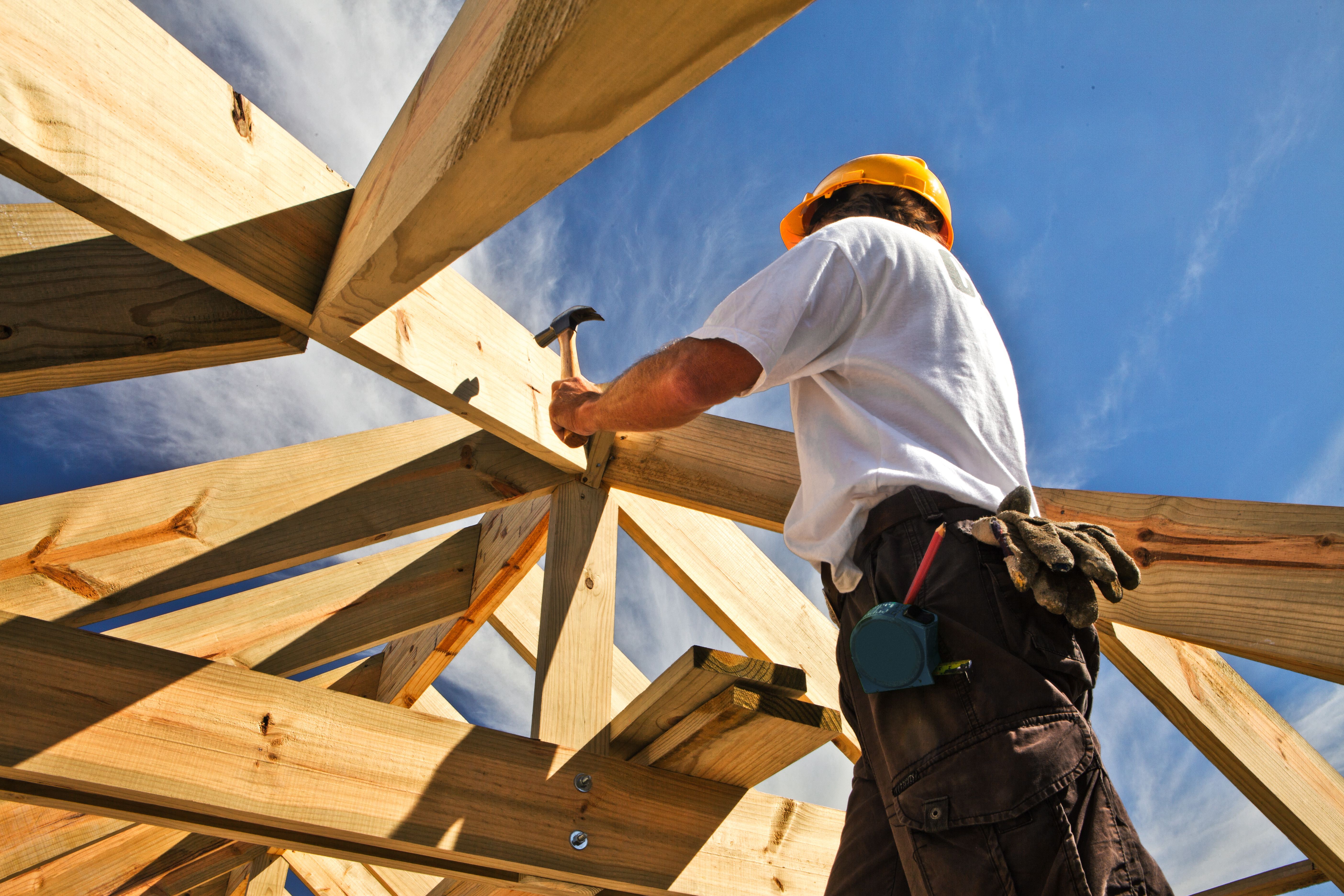 Builder Working on House Frame