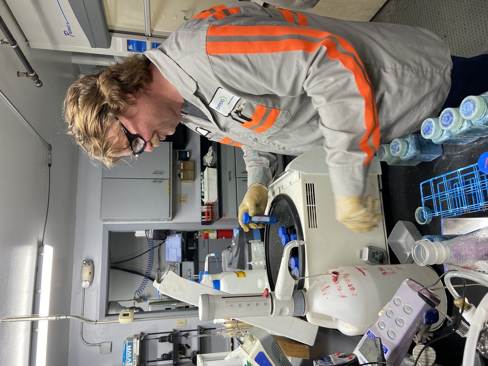 Koppers technician operating a laboratory centrifuge