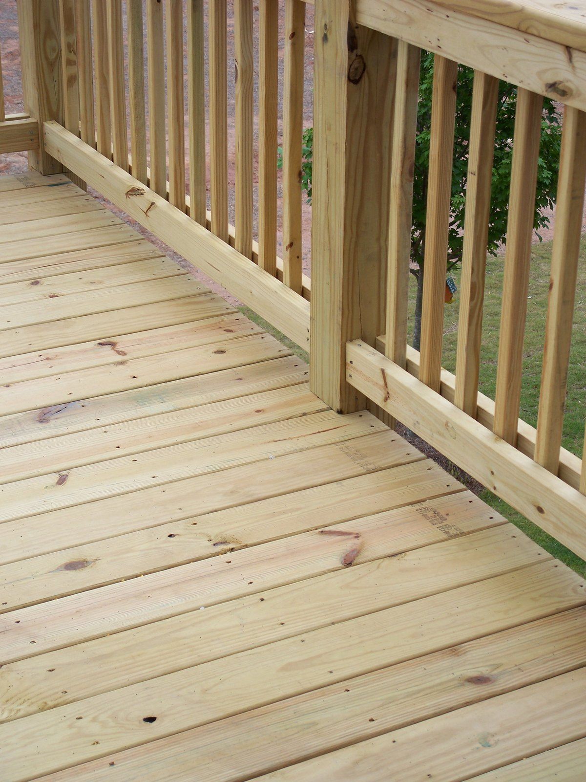 Pale treated deck boards and railing